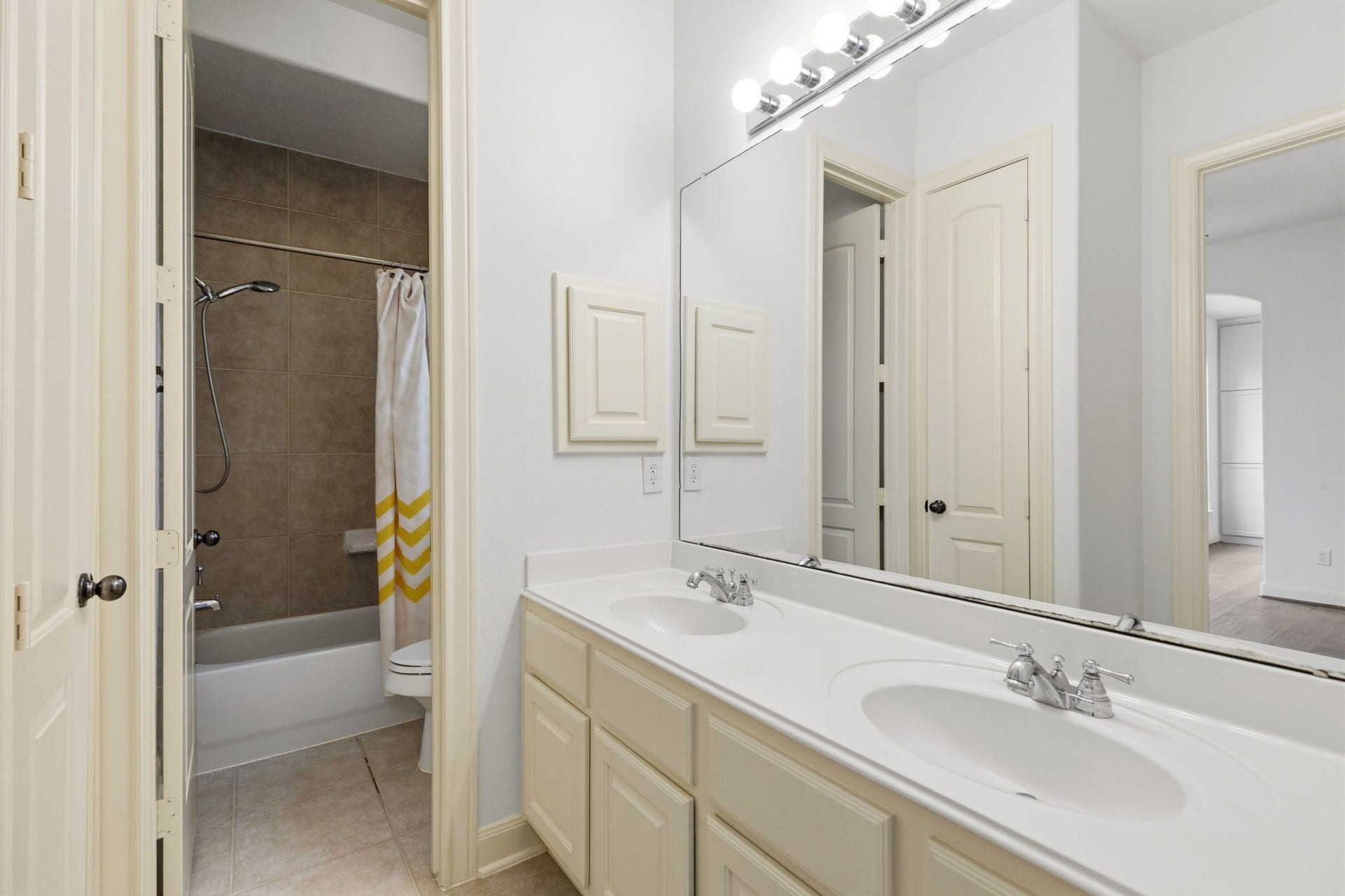 One of three full bathrooms down stairs.  Connected to the mother in law suite.