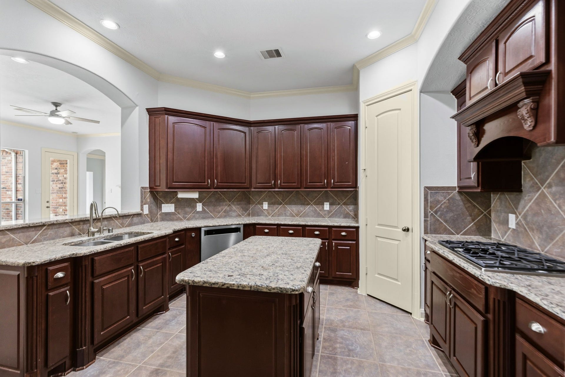 Kitchen is fully open to the living area.  Tons of cabinets and big pantry.