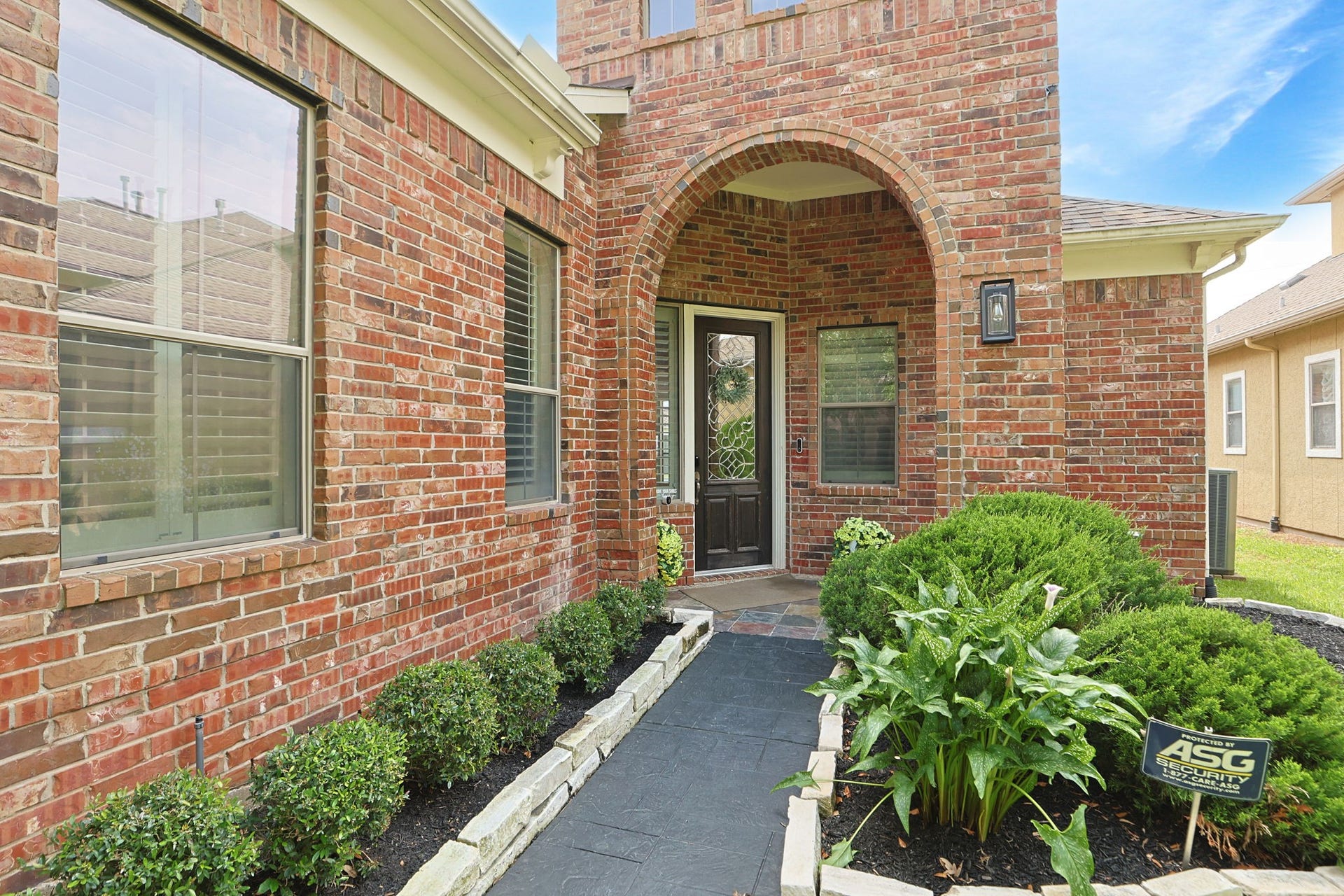 Entrance to your new home with leaded glass door.  Home has fresh interior paint throughout including all the trim and plantation shutters.