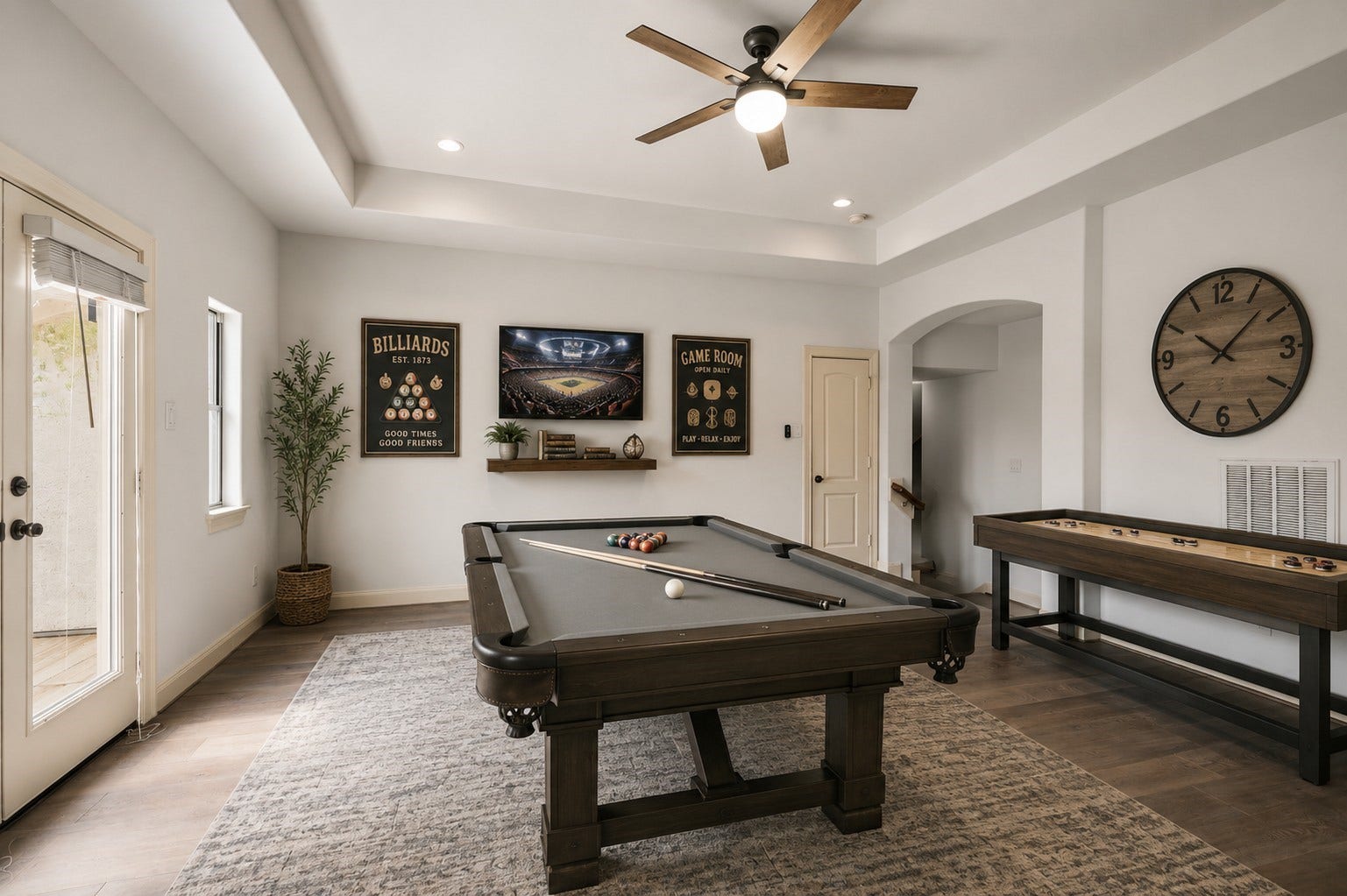 Game room upstairs has a balcony over looking the backyard.