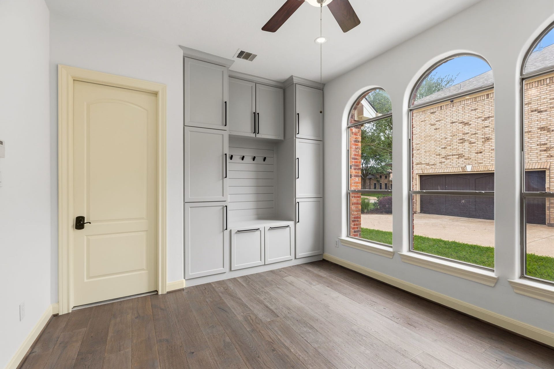 Mother-in-law suite with custom built-ins and access to the garage.  Love all these beautiful wood floors!