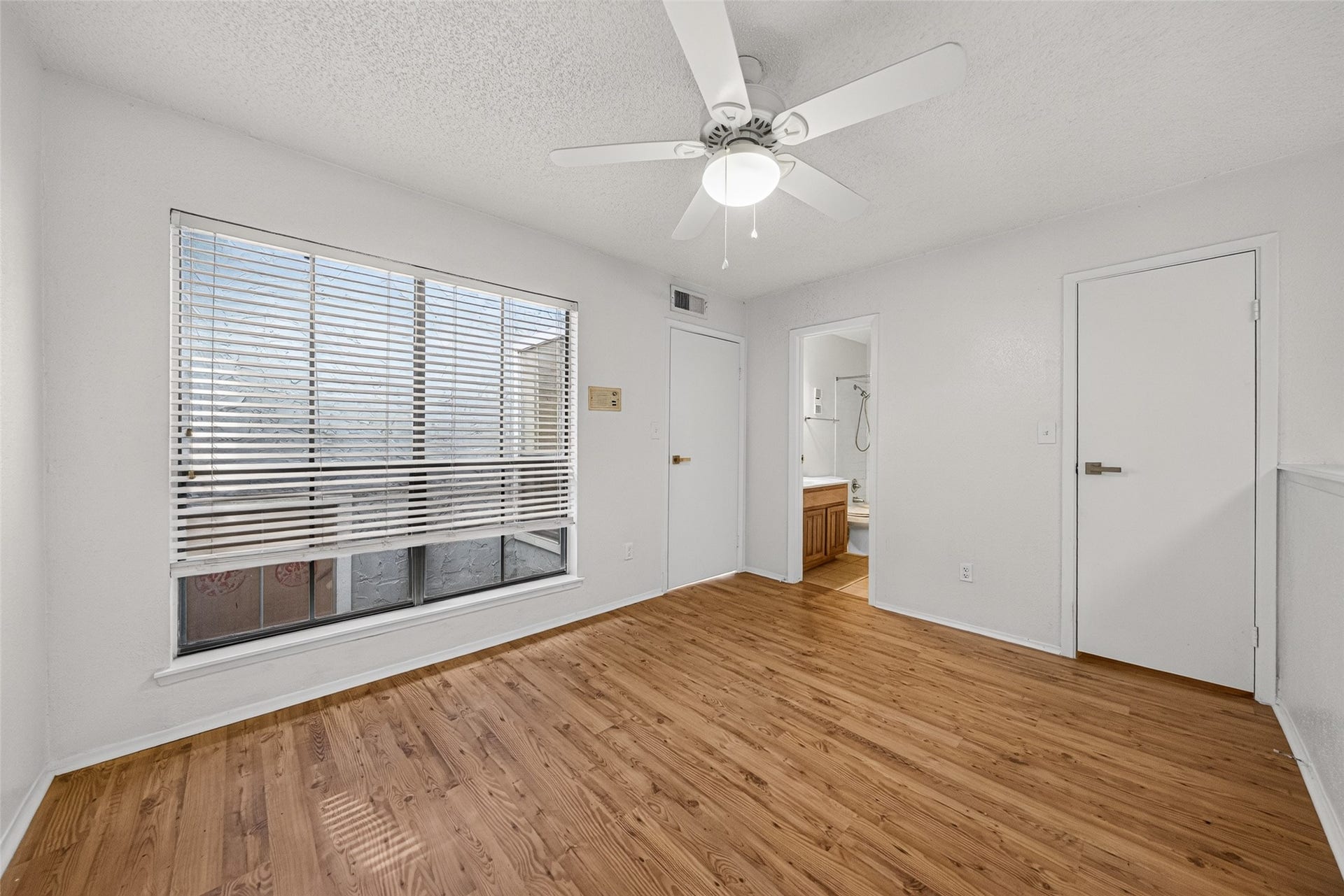 Another view of the upstairs bonus area highlighting its open layout and natural light.