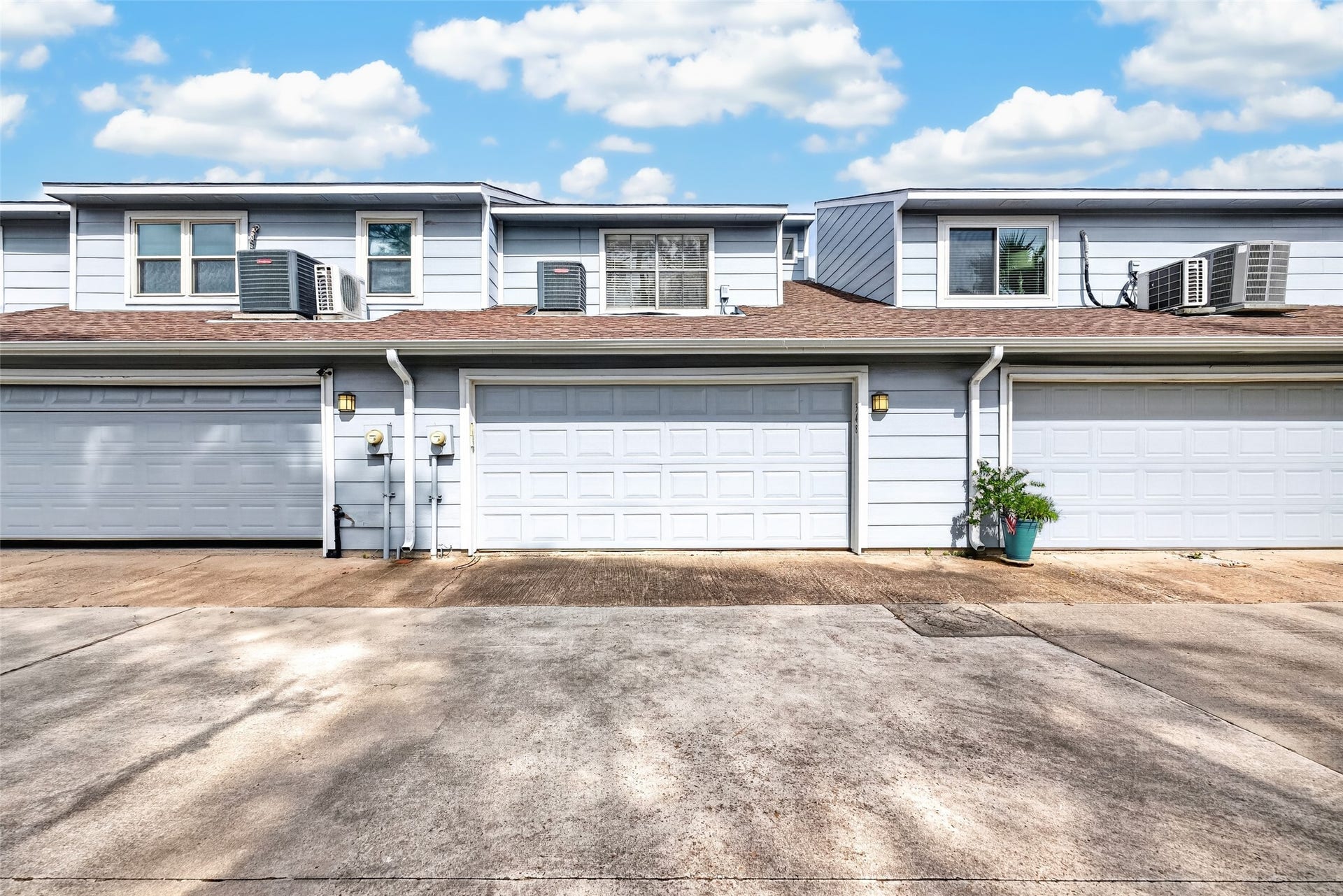 Exterior view of the attached two-car garage with direct driveway access.