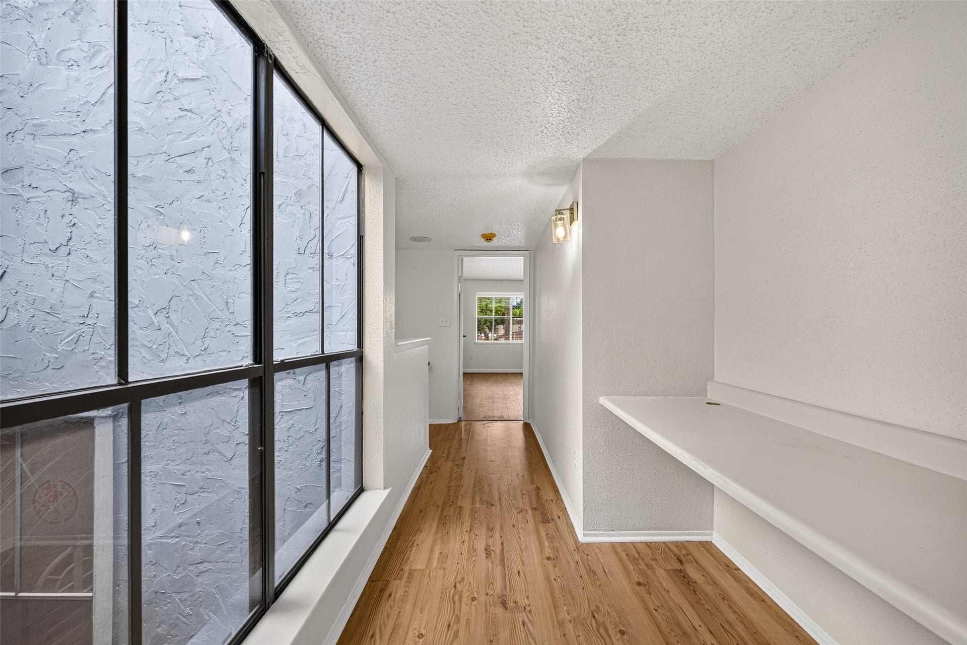 Upstairs hallway with built-in desk counter, ideal for a convenient study or workspace.