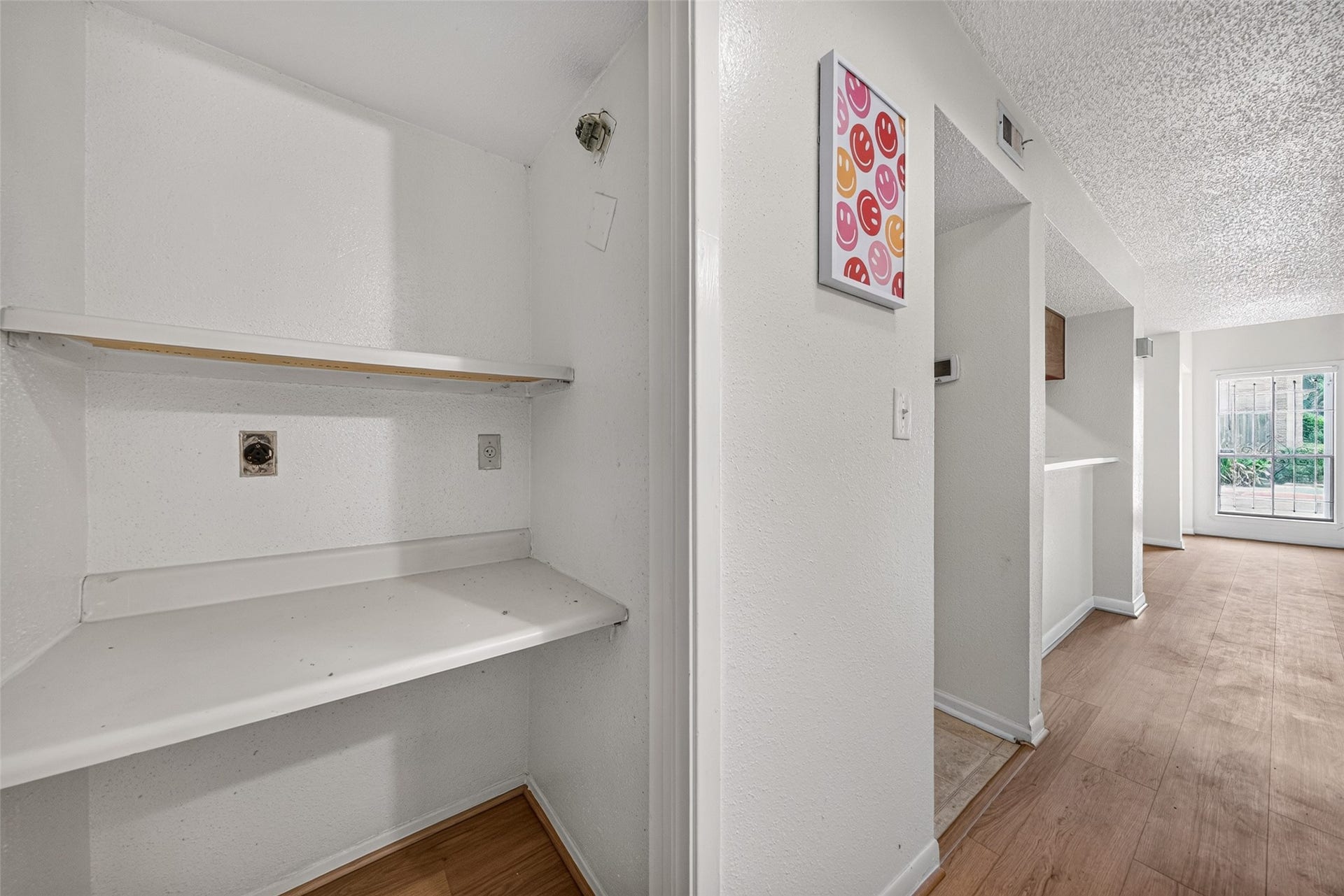 Flexible study or utility area with built-in shelving