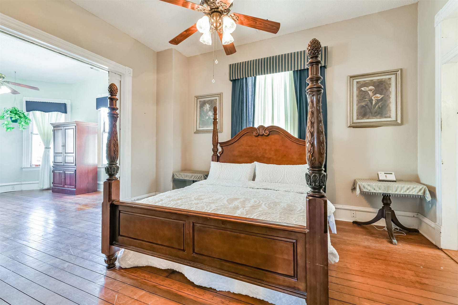 1927 Broadway Street, Galveston, TX 77550 Also located on the second floor, this space is truly a master retreat, boasting a cozy bedroom with an additional parlor area with long leaf pine wood floors, neutral paint, and a lighted ceiling fan.