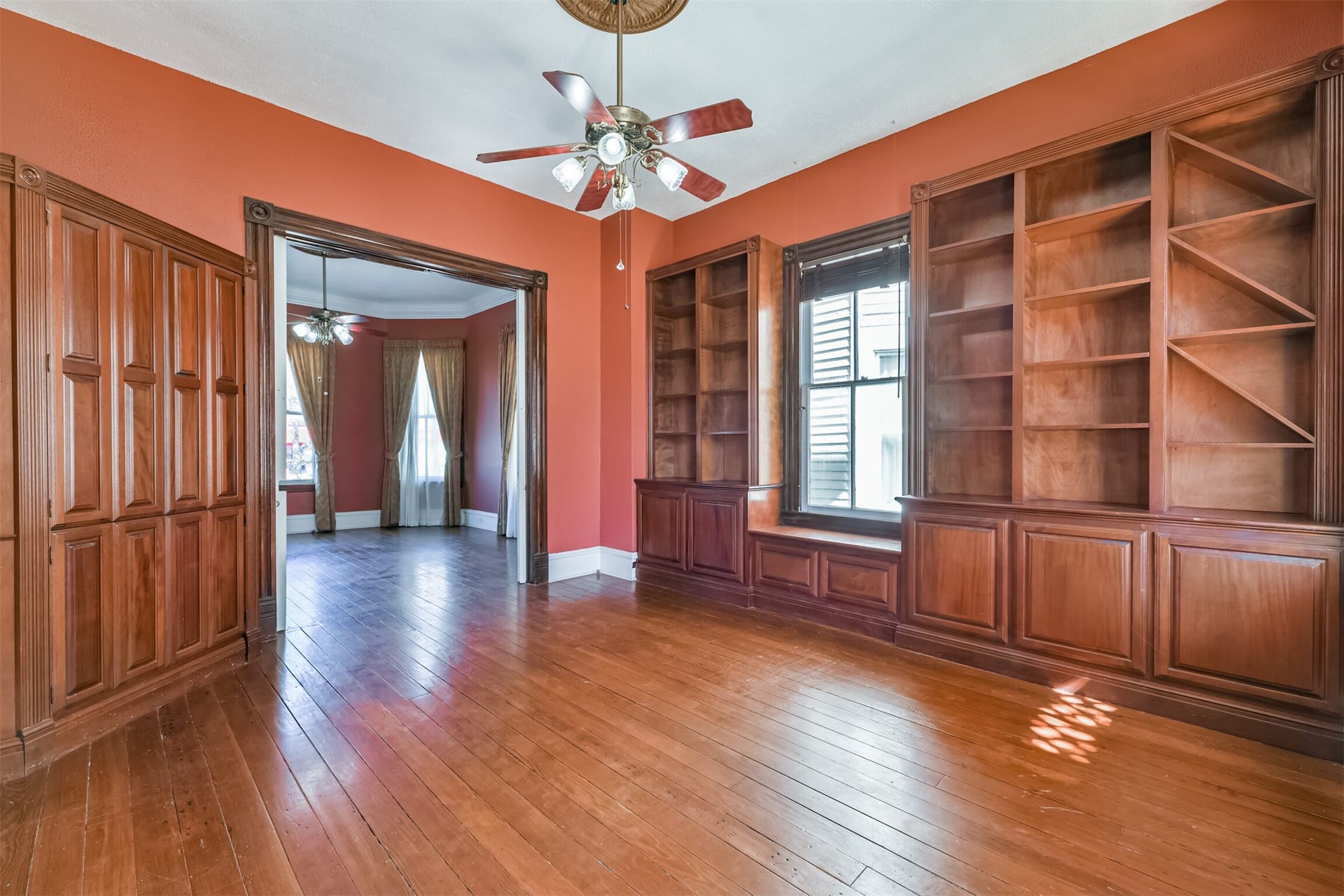 1927 Broadway Street, Galveston, TX 77550 Guests who were well known to the family may have been invited into the more casual and intimate family room that undoubtedly also served as a library, with its walls lined with custom-built shelving and cabinetry with trim that coordinates with the door casings.