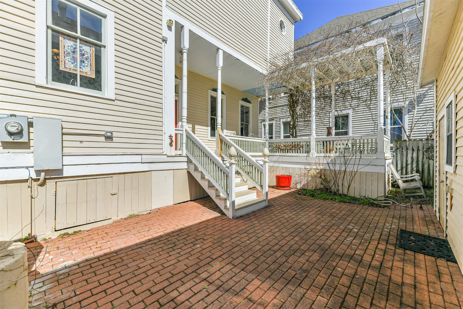 1927 Broadway Street, Galveston, TX 77550 Just a few steps down from the porch of this pier & beam designed home, you'll enjoy a private fenced patio with a brick floor, a small landscaped garden area, and a grilling station.