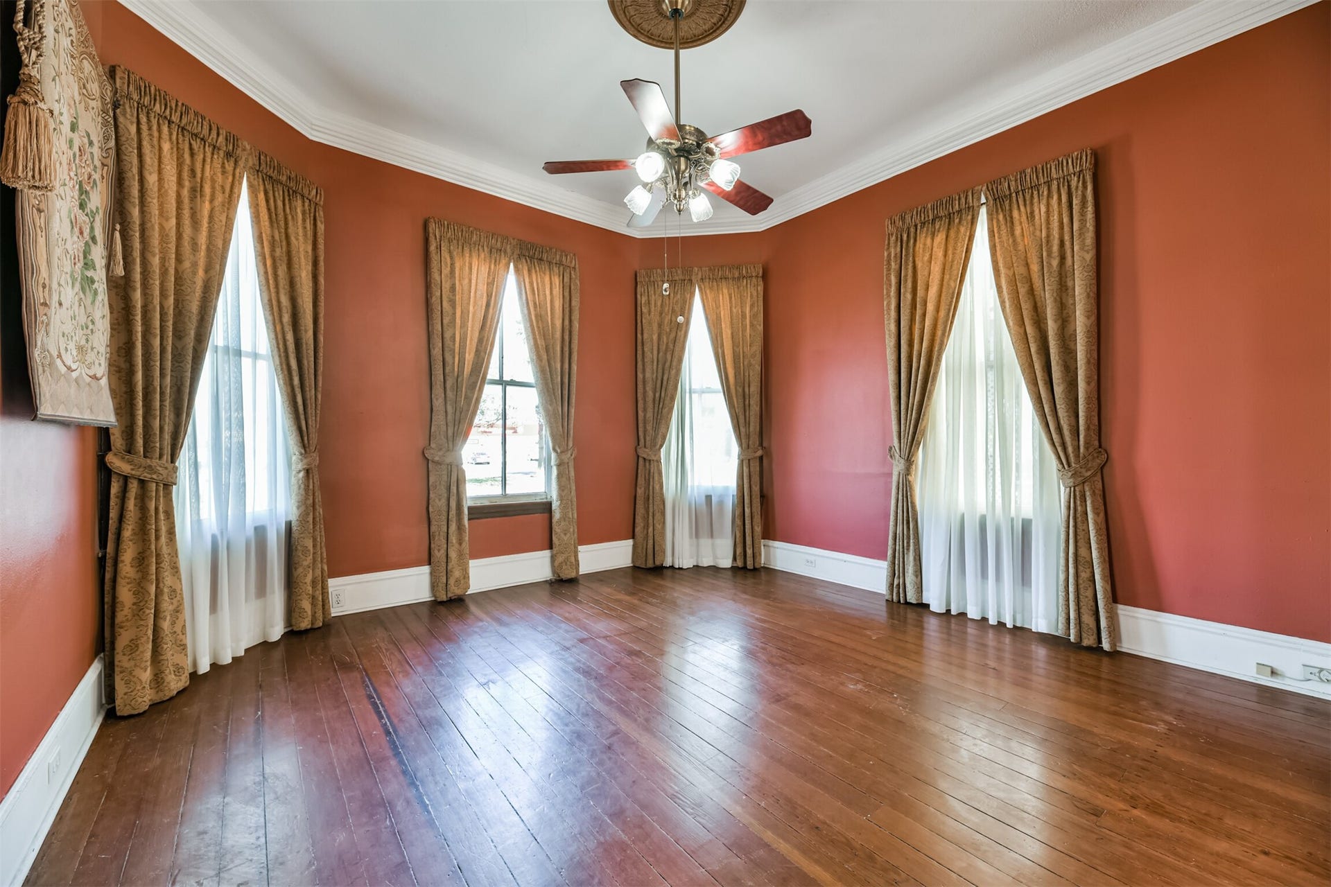 1927 Broadway Street, Galveston, TX 77550 If walls could talk! Many significant conversations have surely transpired in this alcove of the living room that is bathed in sunlight streaming in through beautifully cased bay windows that overlook Broadway in the East End Historic District.
