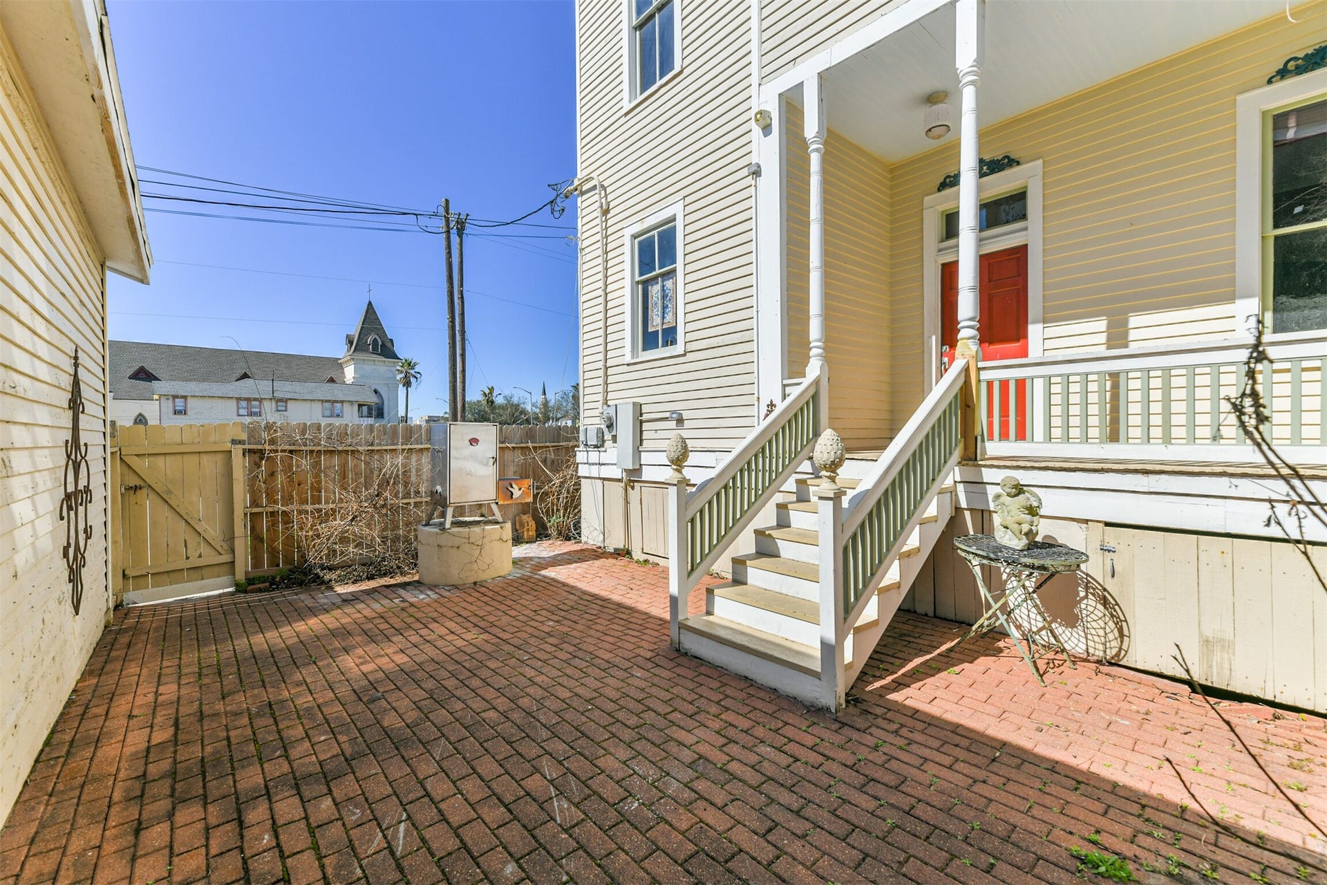 1927 Broadway Street, Galveston, TX 77550 Just a few steps down from the porch of this pier & beam designed home, you'll enjoy a private fenced patio with a brick floor, a small landscaped garden area, and a grilling station.