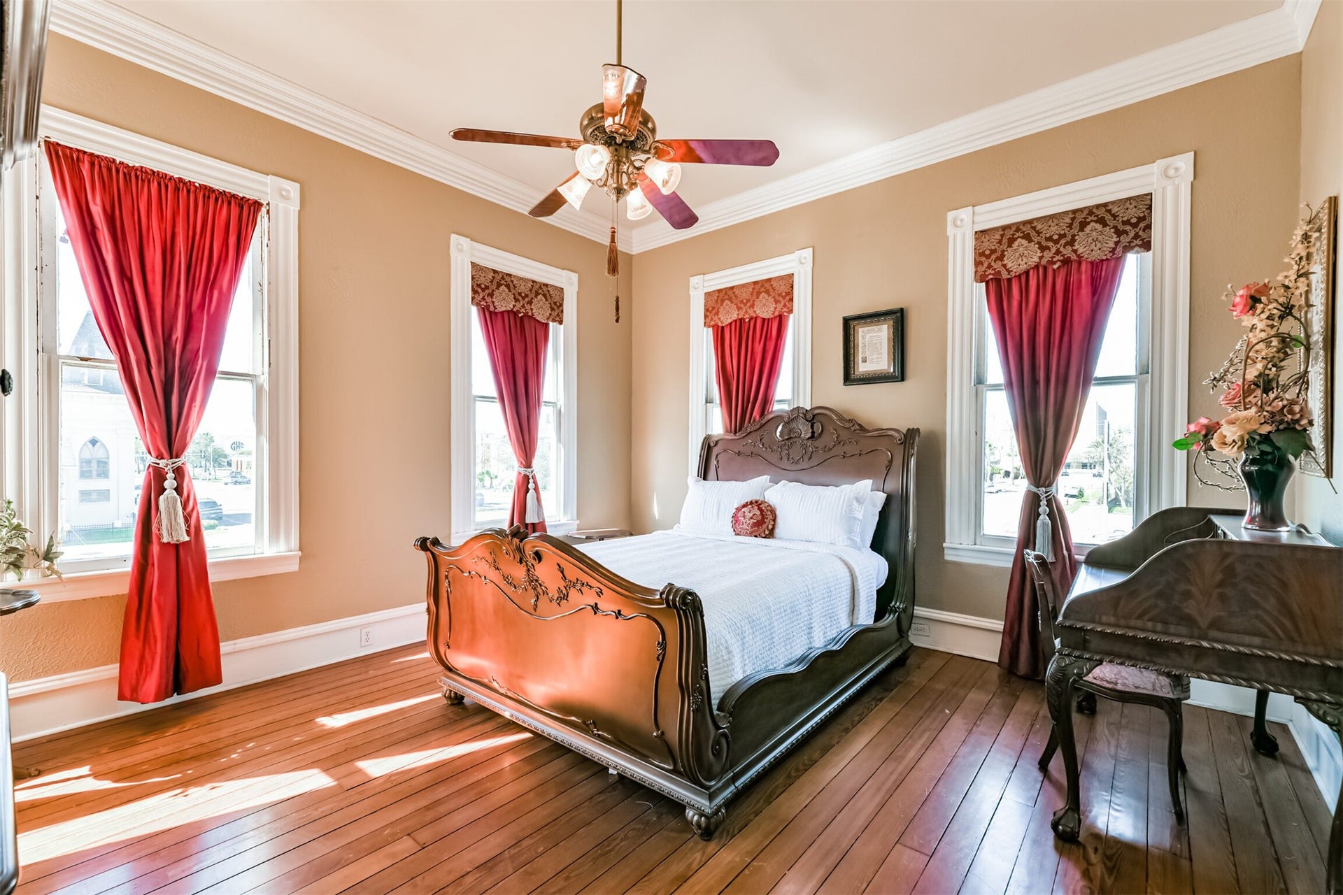 1927 Broadway Street, Galveston, TX 77550 Just off of the second-floor landing, you'll enter this charming bedroom that boasts long leaf pine wood floors, neutral paint, and crisp white moldings that frame the numerous windows that encircle the room.
