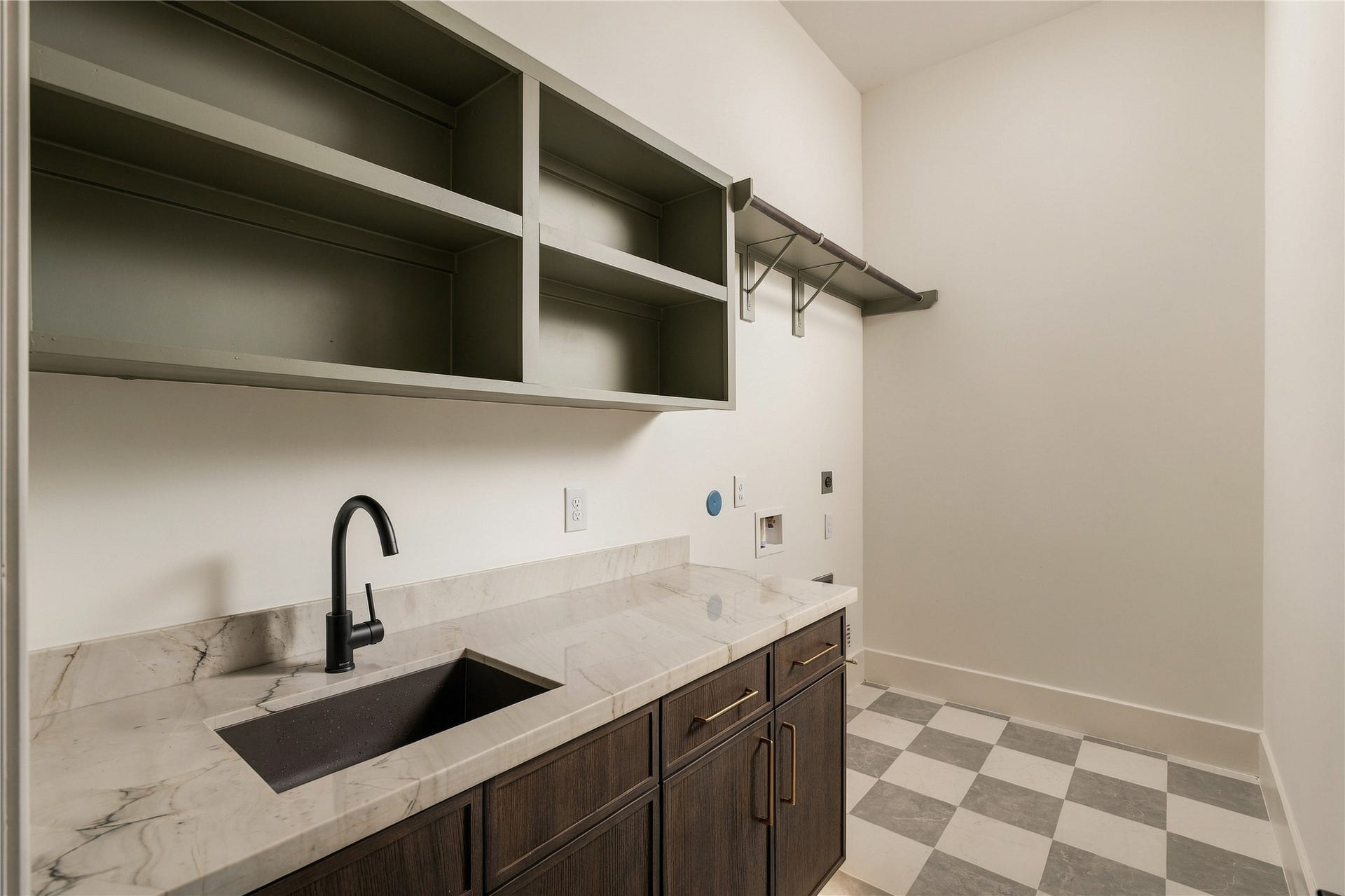 2107 McKean Drive, Houston, TX 77080 Designed to make daily routines more convenient, the utility room offers ample countertop space, upper and lower storage, and a dedicated area for laundry appliances.