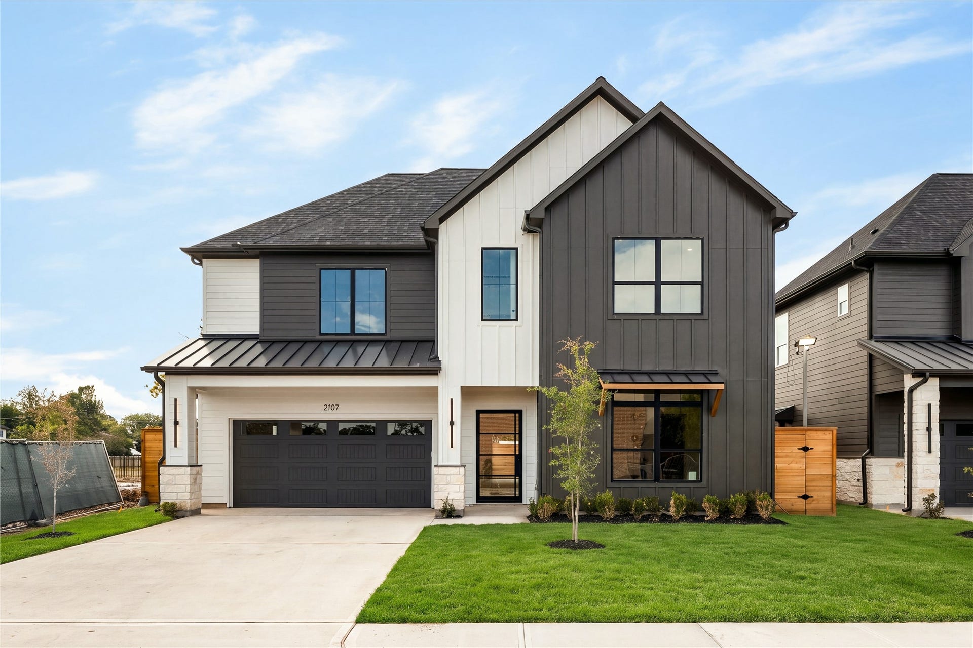 2107 McKean Drive, Houston, TX 77080 Welcome to 2107 McKean Drive, where Nima Homes brings a refined point of view to modern luxury living in Spring Branch, a modern farmhouse masterpiece with an exterior that feels considered from every angle.