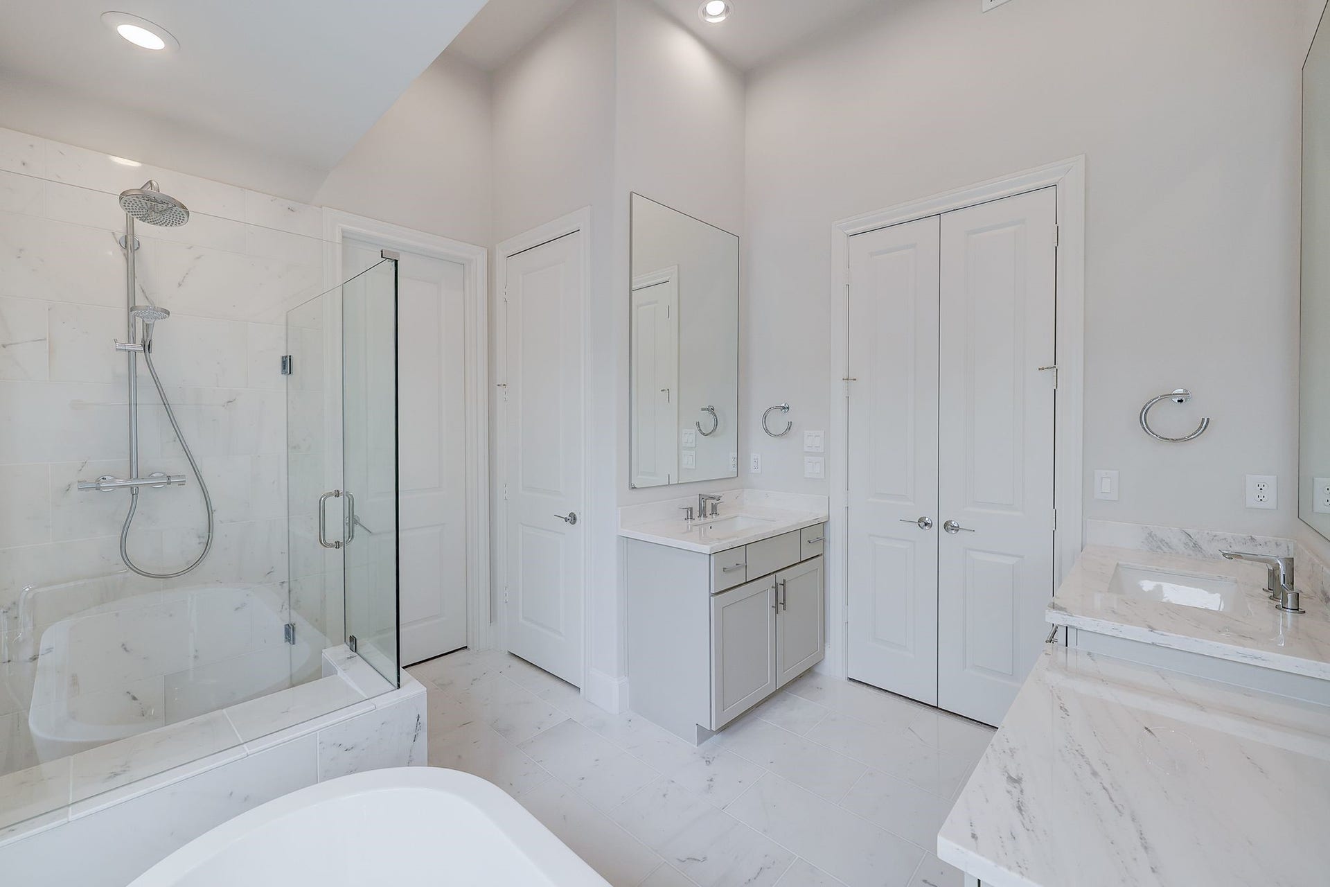 8710 Park Kolbe Lane, Houston, TX 77080 Gorgeous Primary Bathroom - Marble Countertops and Floors. Free Standing Tub and Seated Shower.