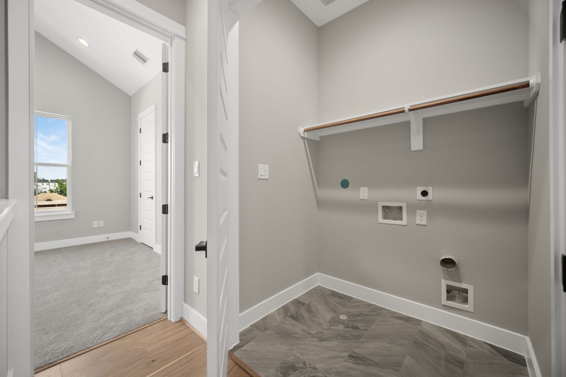 1175 W 19th Street, Houston, TX 77008 Utility room in house located on third level for convenience.
