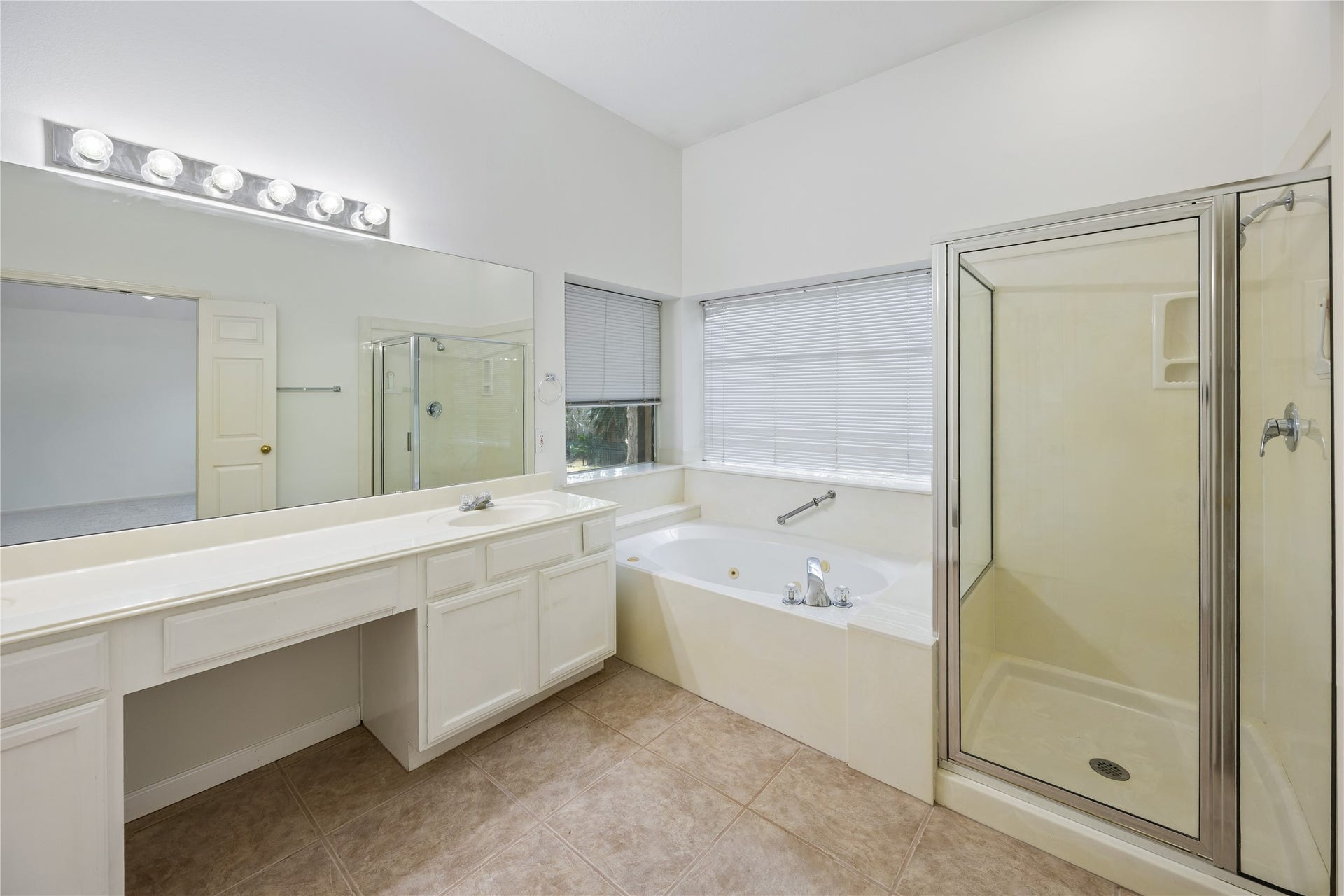 16926 Cobbler Crossing Drive, Sugar Land, TX 77498 The private ensuite gives you room to slow down and recharge, with a jetted soaking tub, separate glass enclosed shower, a dual sink vanity space and plenty of natural light.