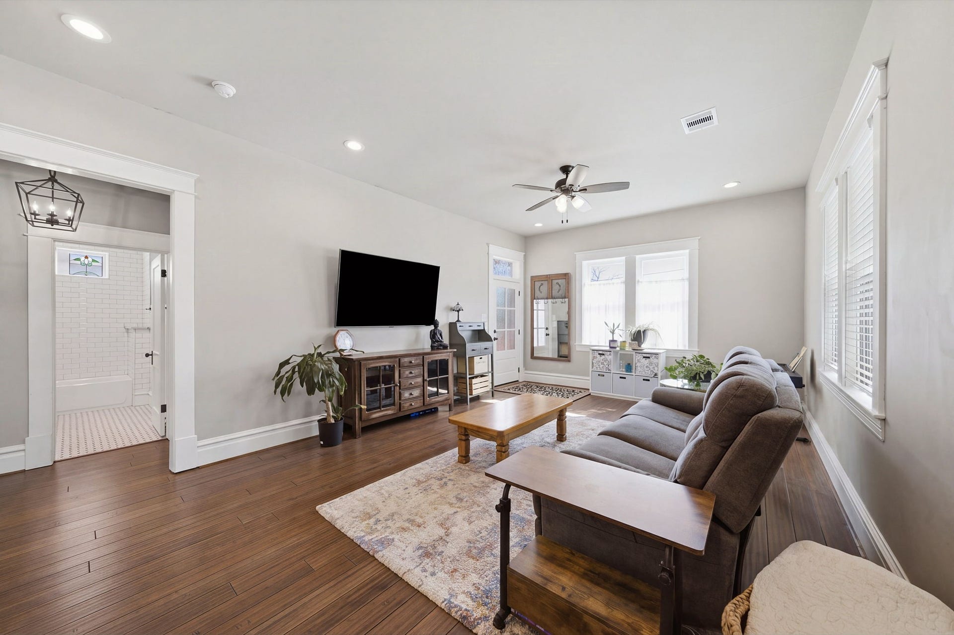 Note the (Jeldwen) wood windows that let in SO MUCH NATURAL LIGHT! Opening on the left leads to 2 guest bedrooms and guest bath. Recessed lighting throughout the Living-Dining-Kitchen!