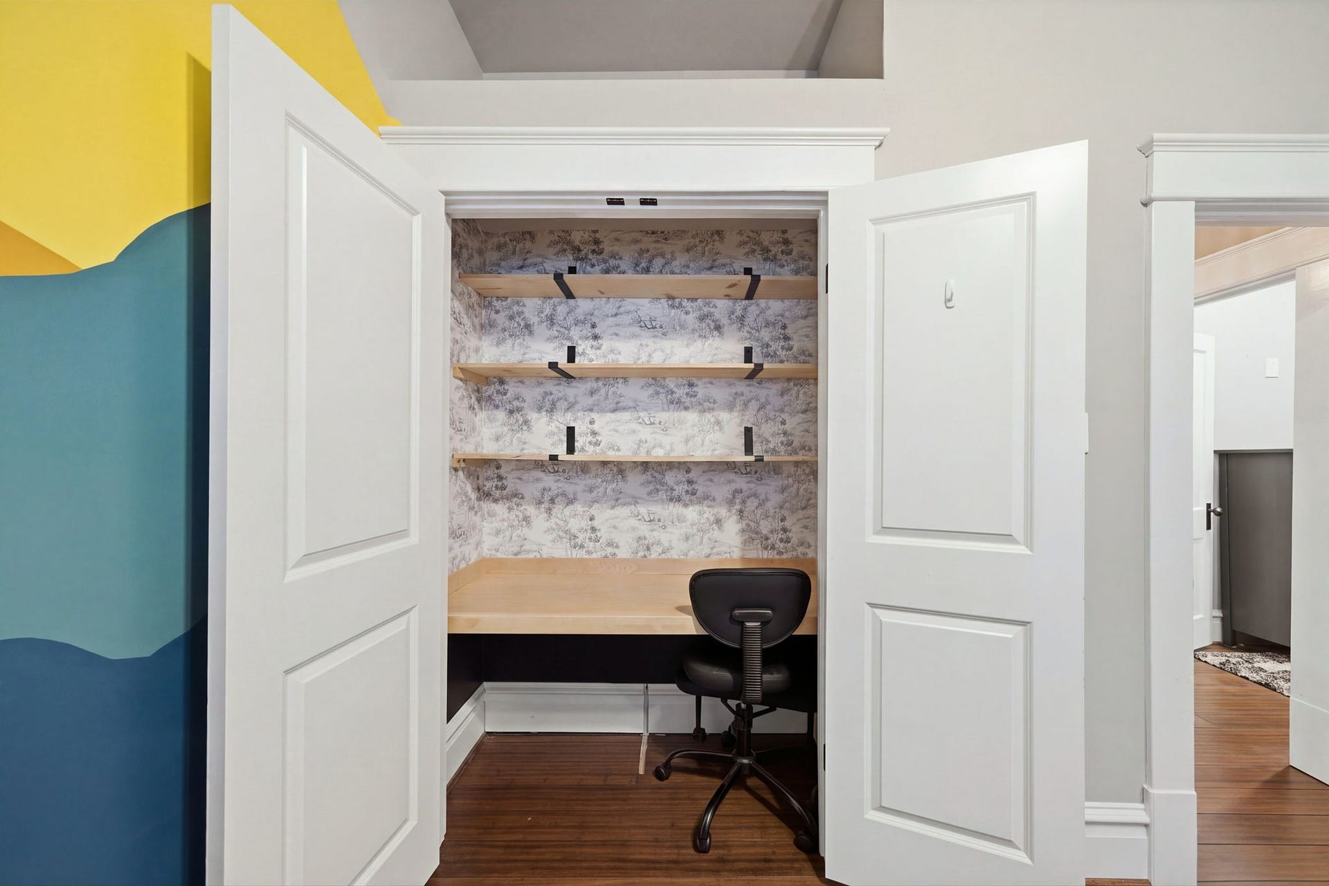 Double door closet has been converted into a craft space! Plenty of storage and room for your creative ideas!