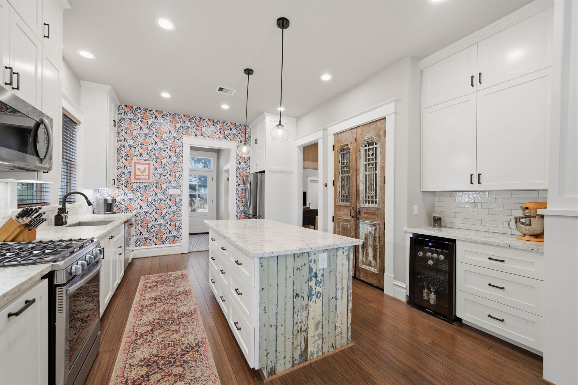 Wonderful kitchen to cook in - everything is close by! Gas range and 30" s/steel sink on the left. Fridge and pantry on the right. Stainless steel appliances throughout. Drinks station for coffee and wine - wine cooler will convey!