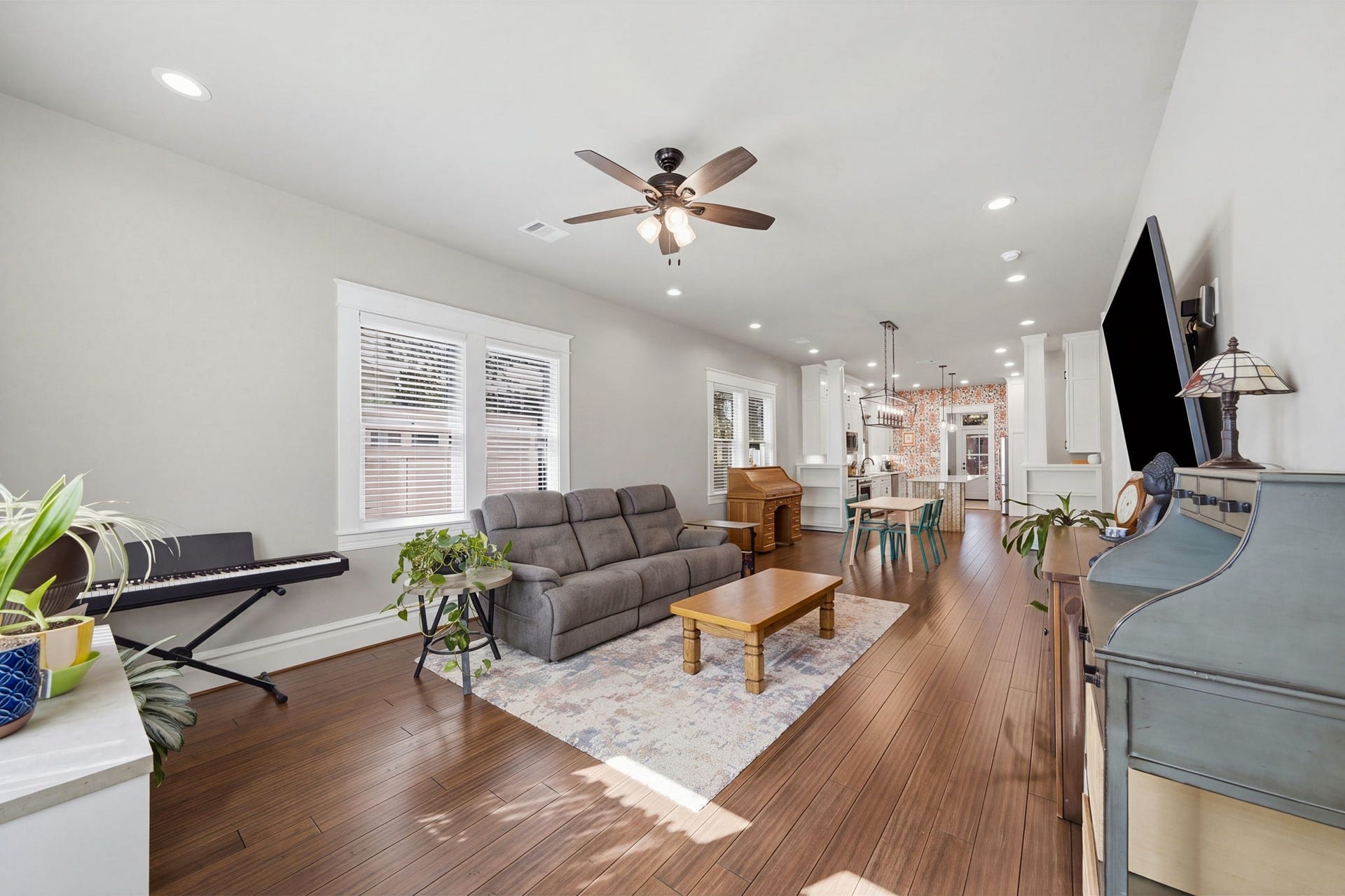 Standing at the front door, looking at the rest of the OPEN-PLAN home - Dining area in the center of the space, and Kitchen anchors the rear!