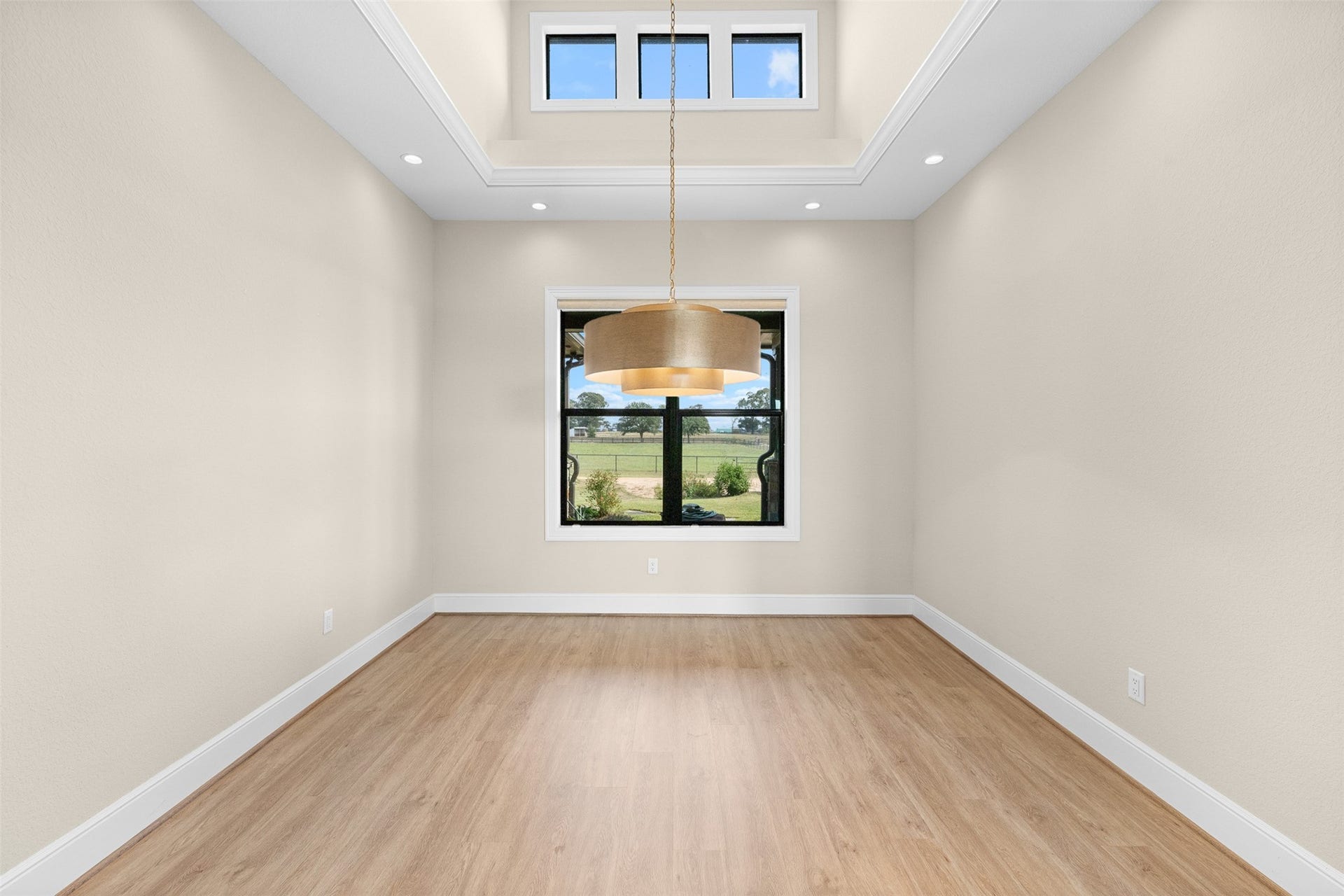 30163 High Spirit Ranch Road, Hempstead, TX 77445 Formal dining room space with high ceilings, custom lighting and thoughfully placed windows to add interest and light.
