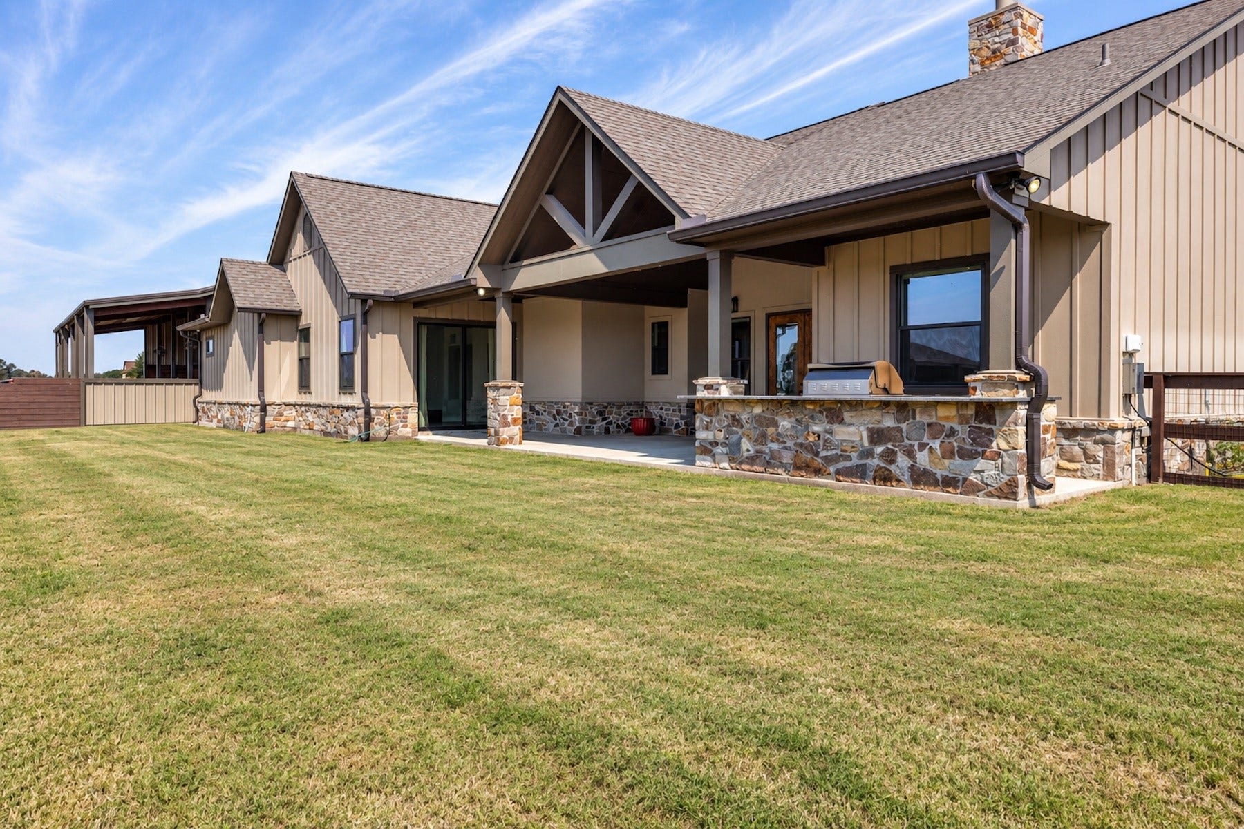 30163 High Spirit Ranch Road, Hempstead, TX 77445 Large covered back patio comes equipped with an outdoor kitchen.