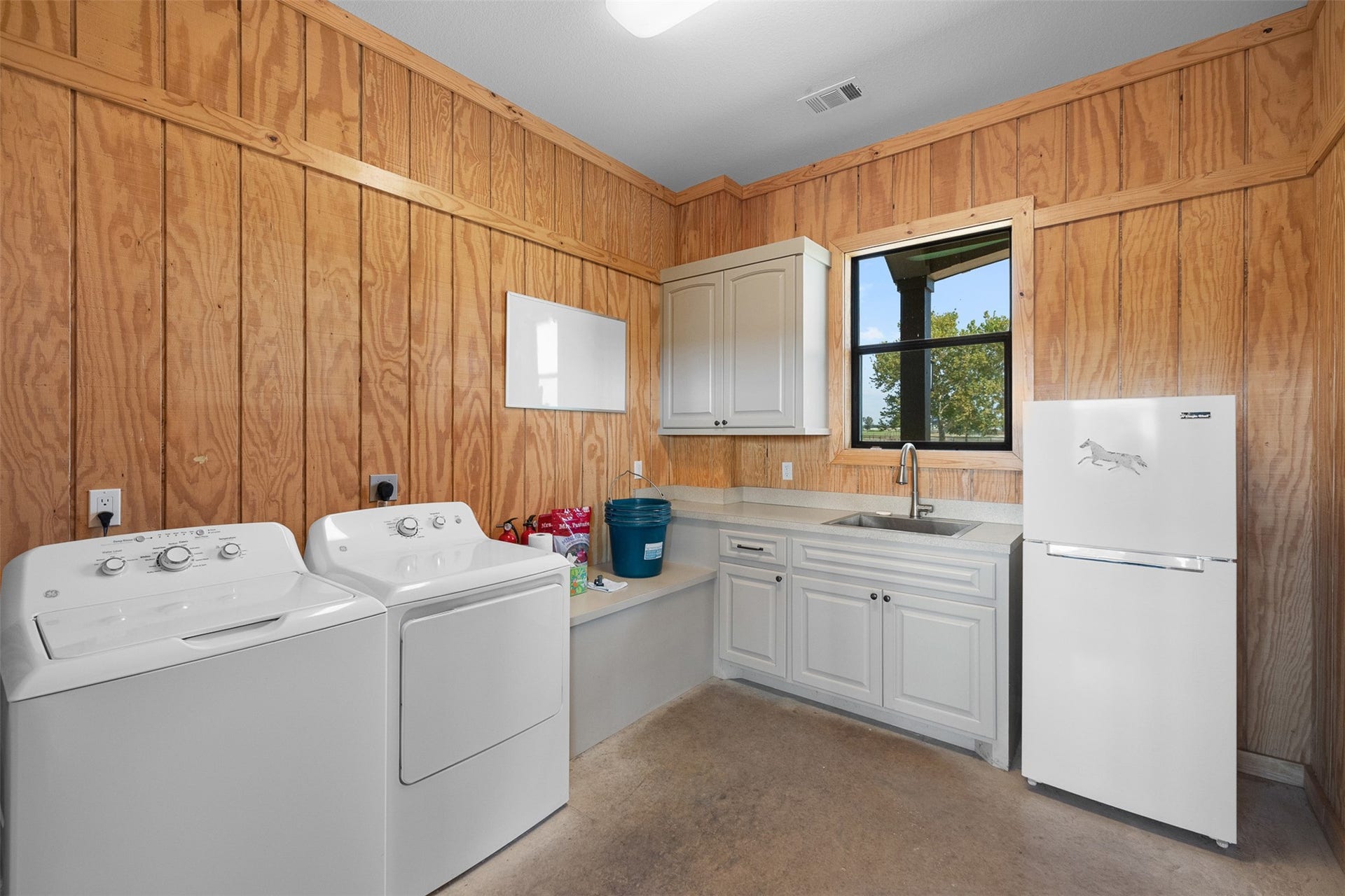 30163 High Spirit Ranch Road, Hempstead, TX 77445 In the barn area, there is a storage room for tack, laundry, etc.