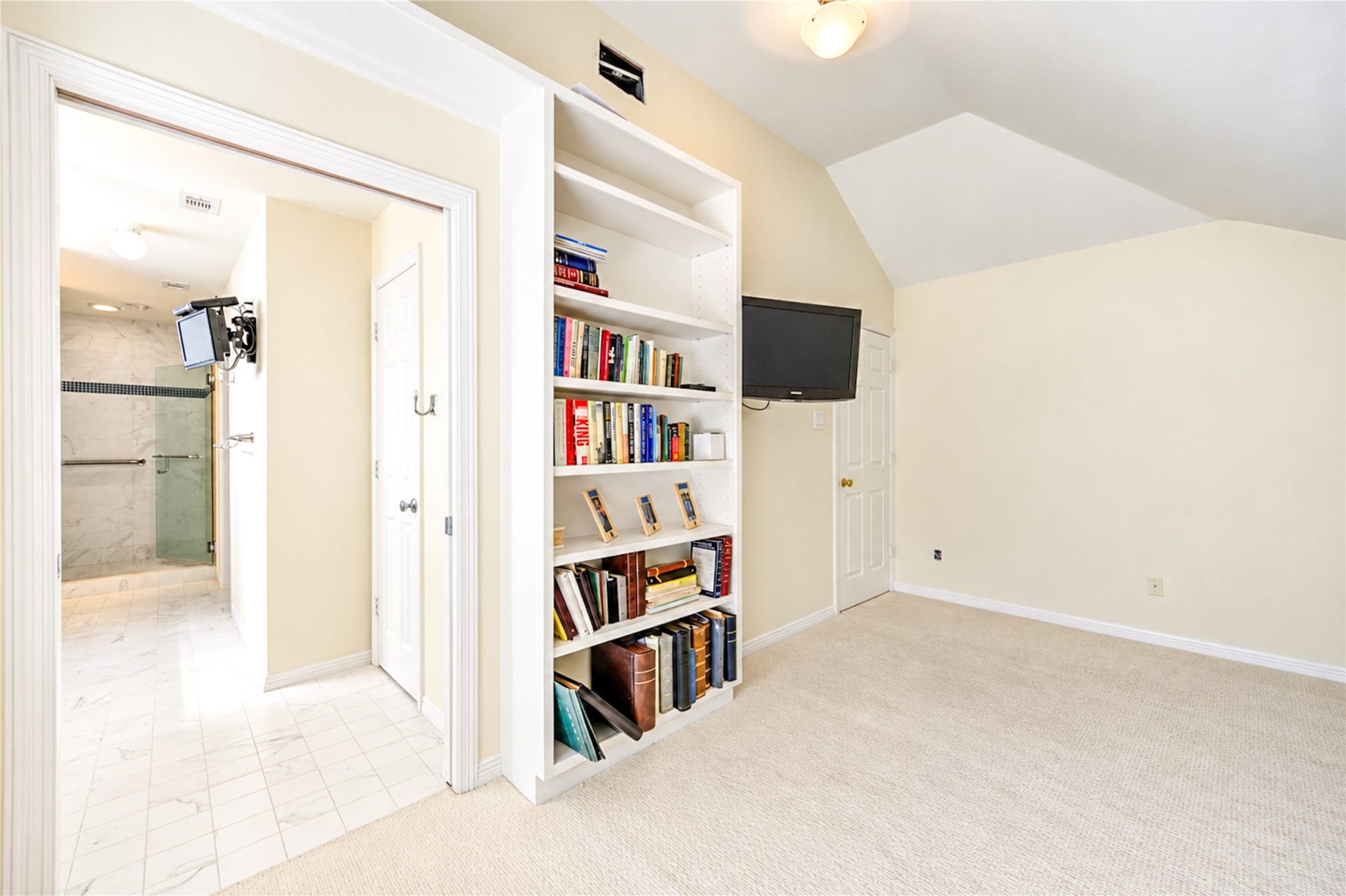 4 Milan Estates, Houston, TX 77056 Another perspective highlights the bedroom's custom built-ins and convenient access to the adjoining bathroom.