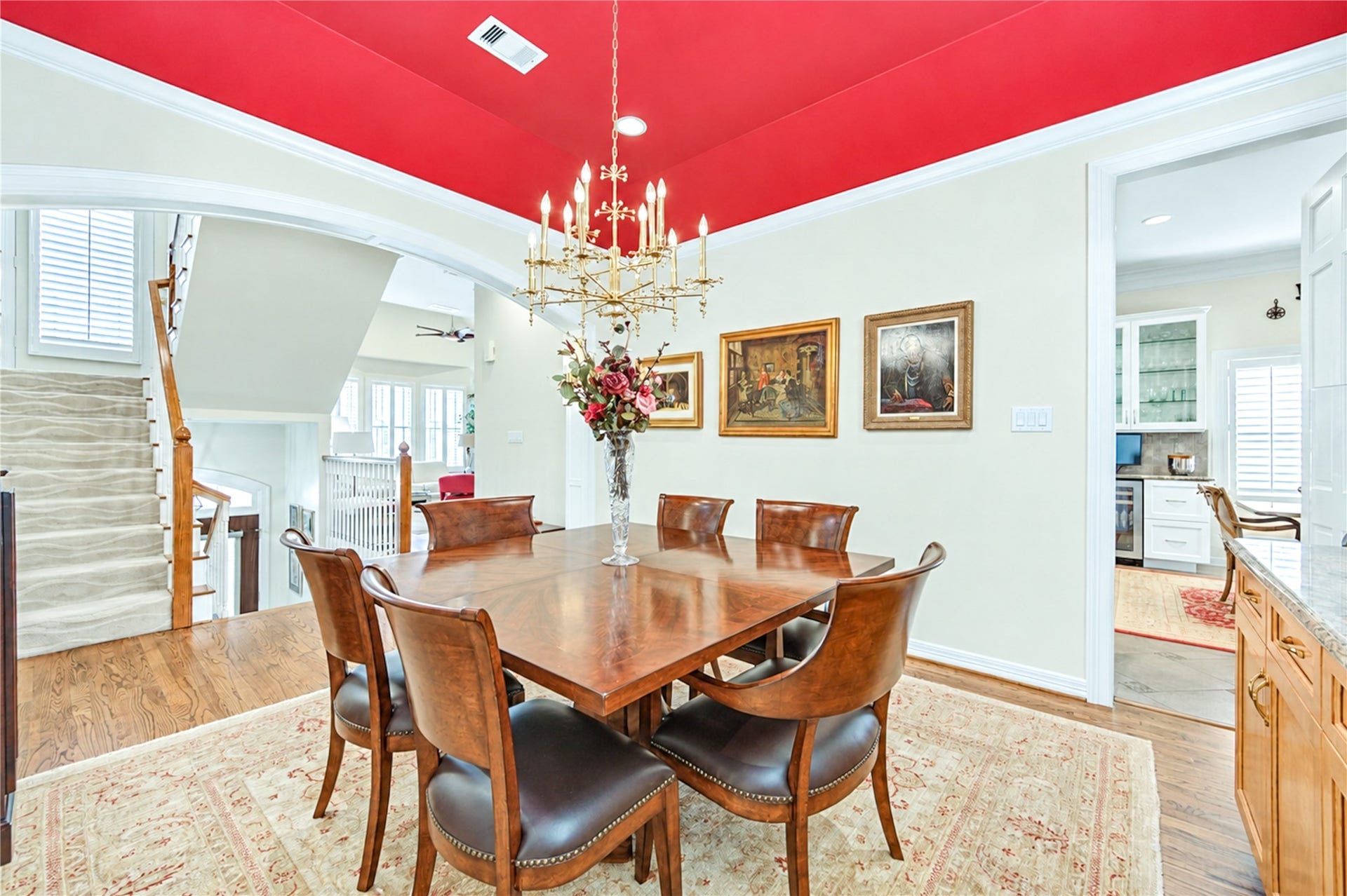 4 Milan Estates, Houston, TX 77056 The elegant formal dining room features hardwood floors, refined crown molding and an arched opening, creating a lovely setting for entertaining.