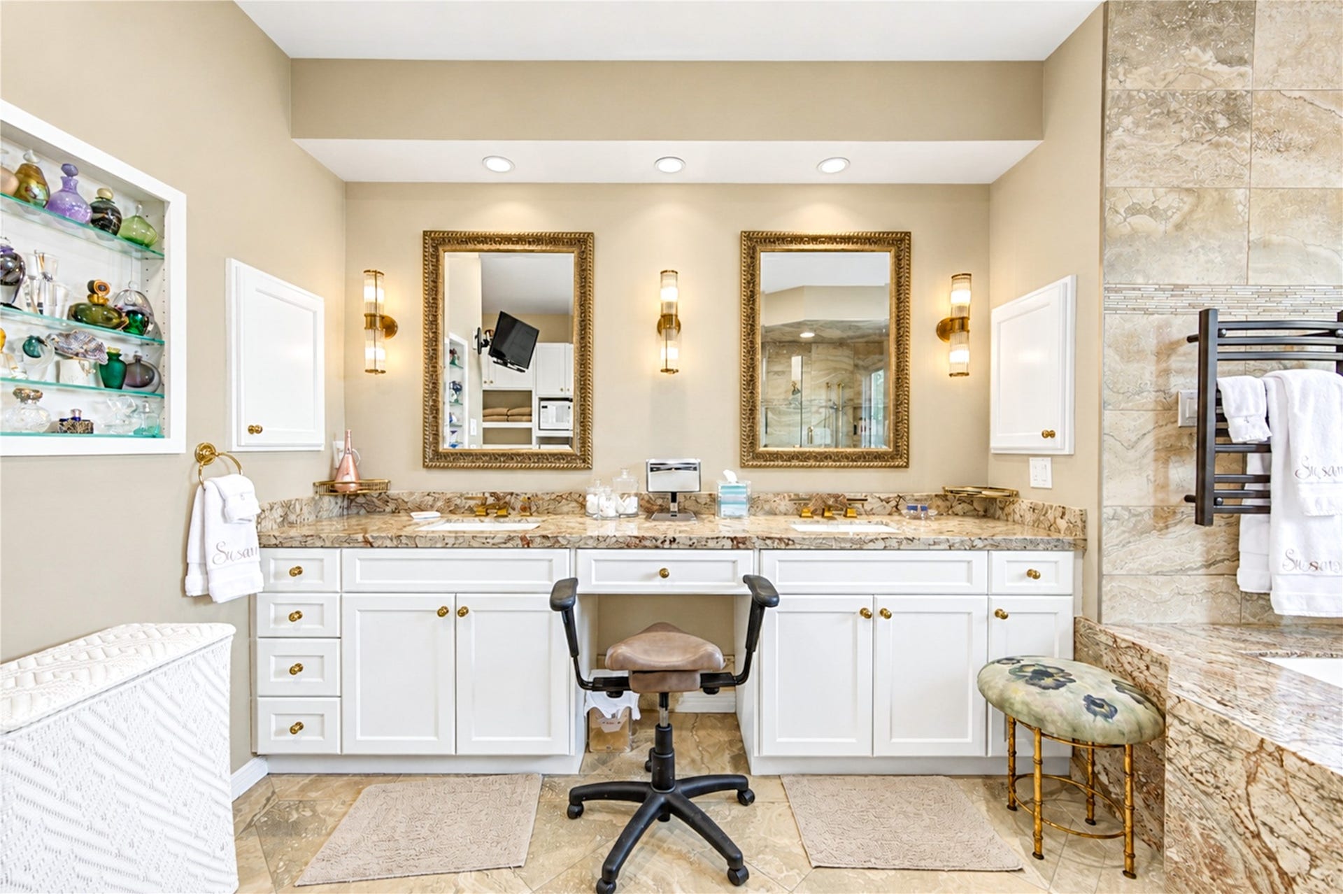 4 Milan Estates, Houston, TX 77056 Custom display niches, dual sinks and a heated towel warmer lend the primary bath a spa-like polish.