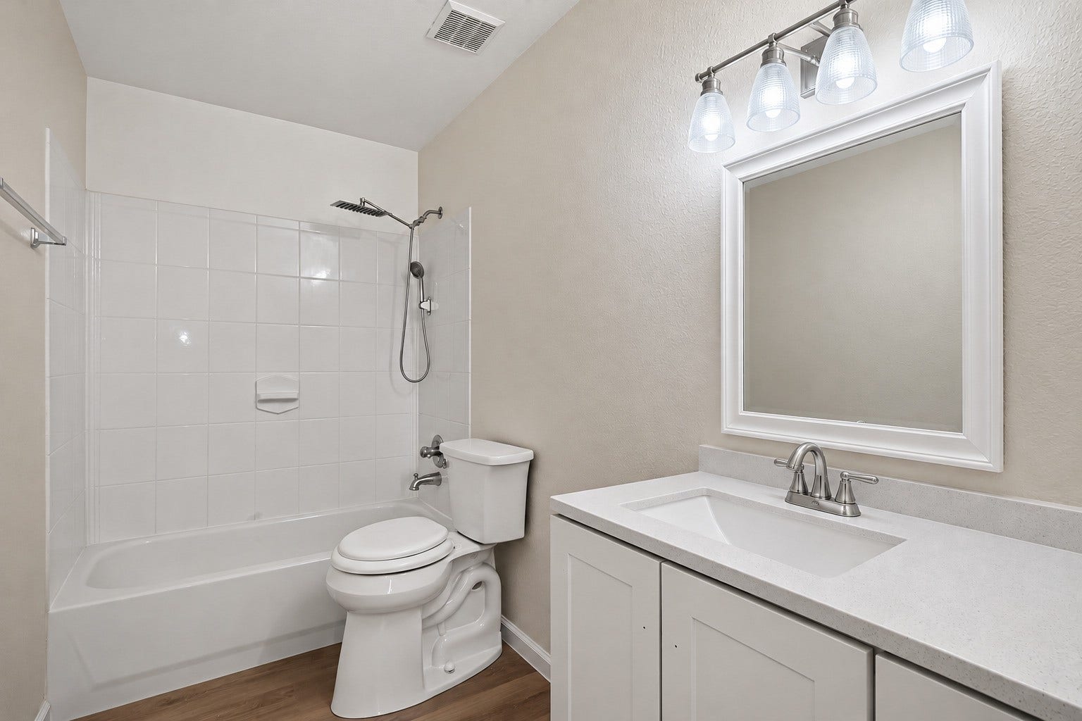 2662 Skyview Glen Court, Houston, TX 77047 A well-appointed vanity sits alongside a tub-and-shower combination wrapped in clean tilework. The straightforward layout and neutral palette create a fresh, versatile bathroom suited to daily use.