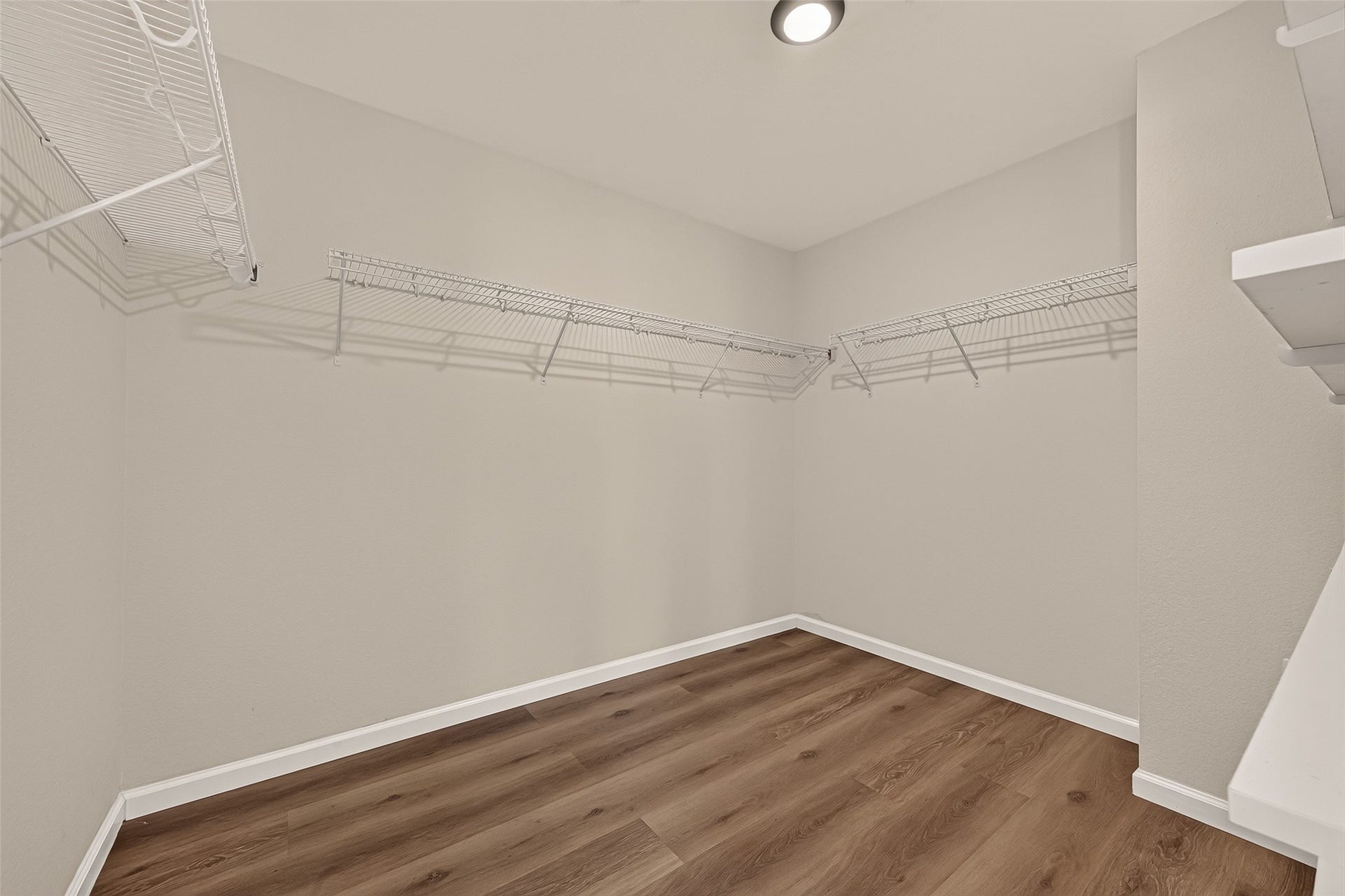 2662 Skyview Glen Court, Houston, TX 77047 A full-entry closet outfitted with shelving and overhead racks provides dedicated places for clothing, accessories, and seasonal items. The organized storage layout helps make the most of the available space.