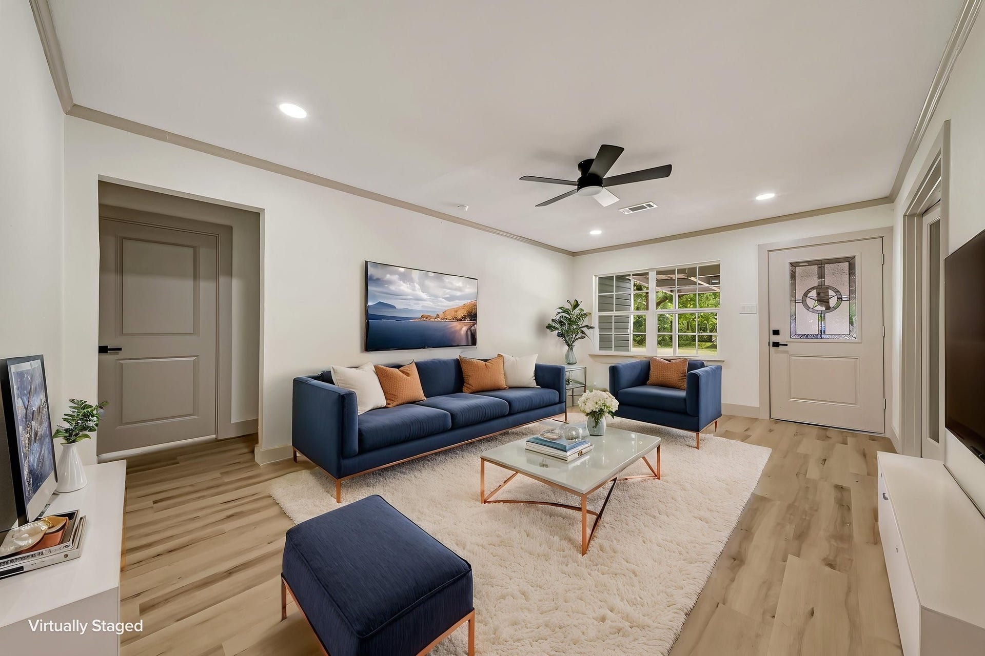 6638 Thornwall Street, Houston, TX 77092 (Photoshopped) Step into a bright, inviting living space featuring sleek, modern furnishings and a cozy atmosphere, enhanced by virtual staging for an inspiring vision of your future home.