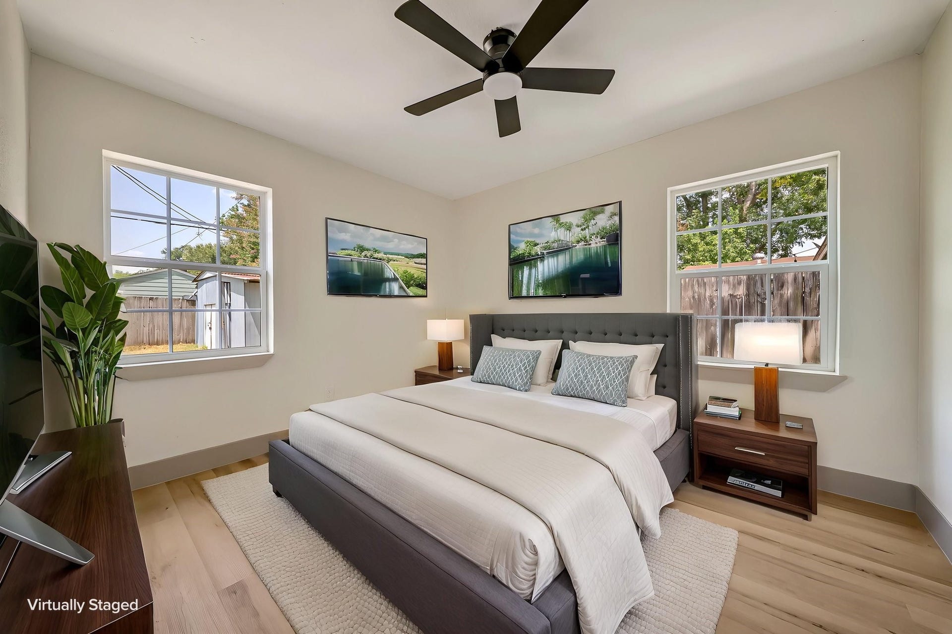 6638 Thornwall Street, Houston, TX 77092 (Photoshopped) Charming and serene, this light-filled bedroom offers a stylish retreat with its modern furnishings and tranquil ambiance, perfect for relaxation.