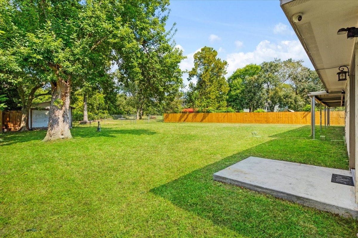 6327 Westcreek Drive, Brookside, TX 77581 Expansive backyard with mature trees and plenty of room for outdoor activities, gardening, or gatherings