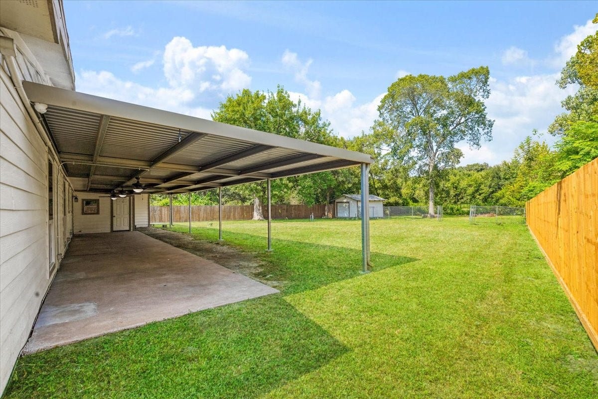 6327 Westcreek Drive, Brookside, TX 77581 Enjoy outdoor living under the spacious covered patio, perfect for entertaining, dining, or relaxing