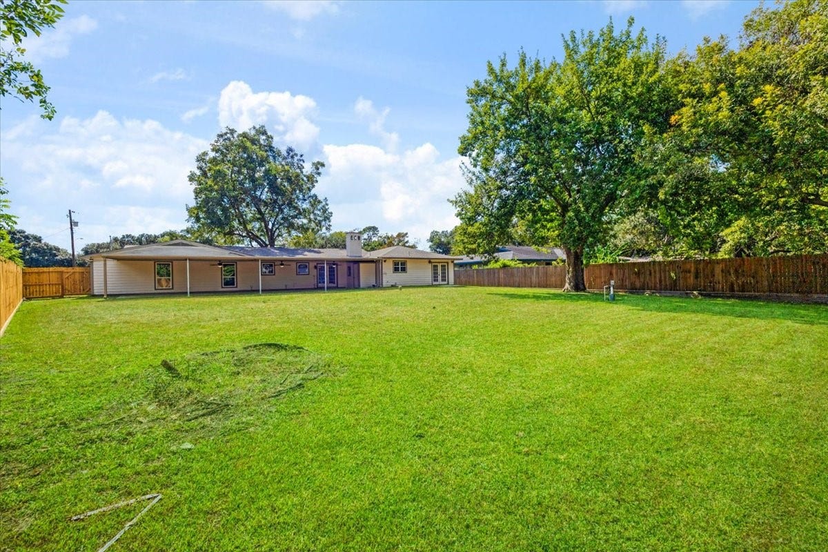 6327 Westcreek Drive, Brookside, TX 77581 Oversized backyard offering beautiful green space, privacy, and endless possibilities for outdoor enjoyment