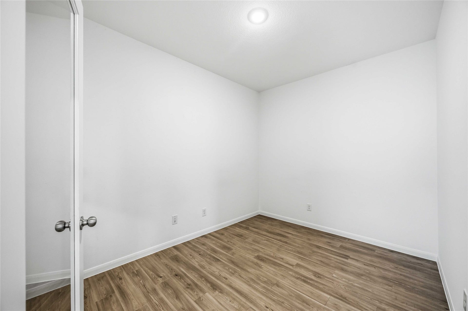 Dedicated home office with wood-look flooring.