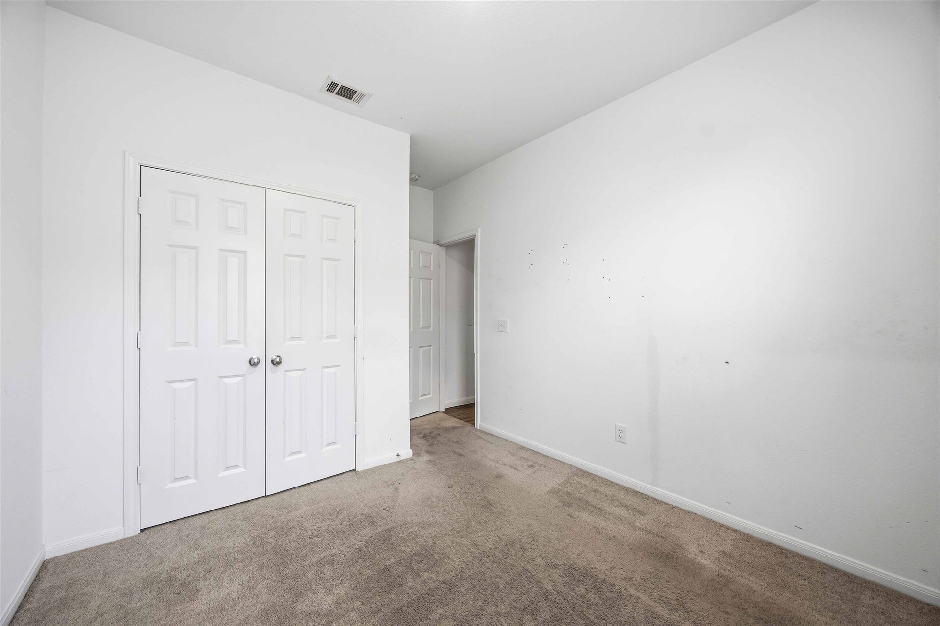 Additional bedroom with a double-door closet and recessed lighting.