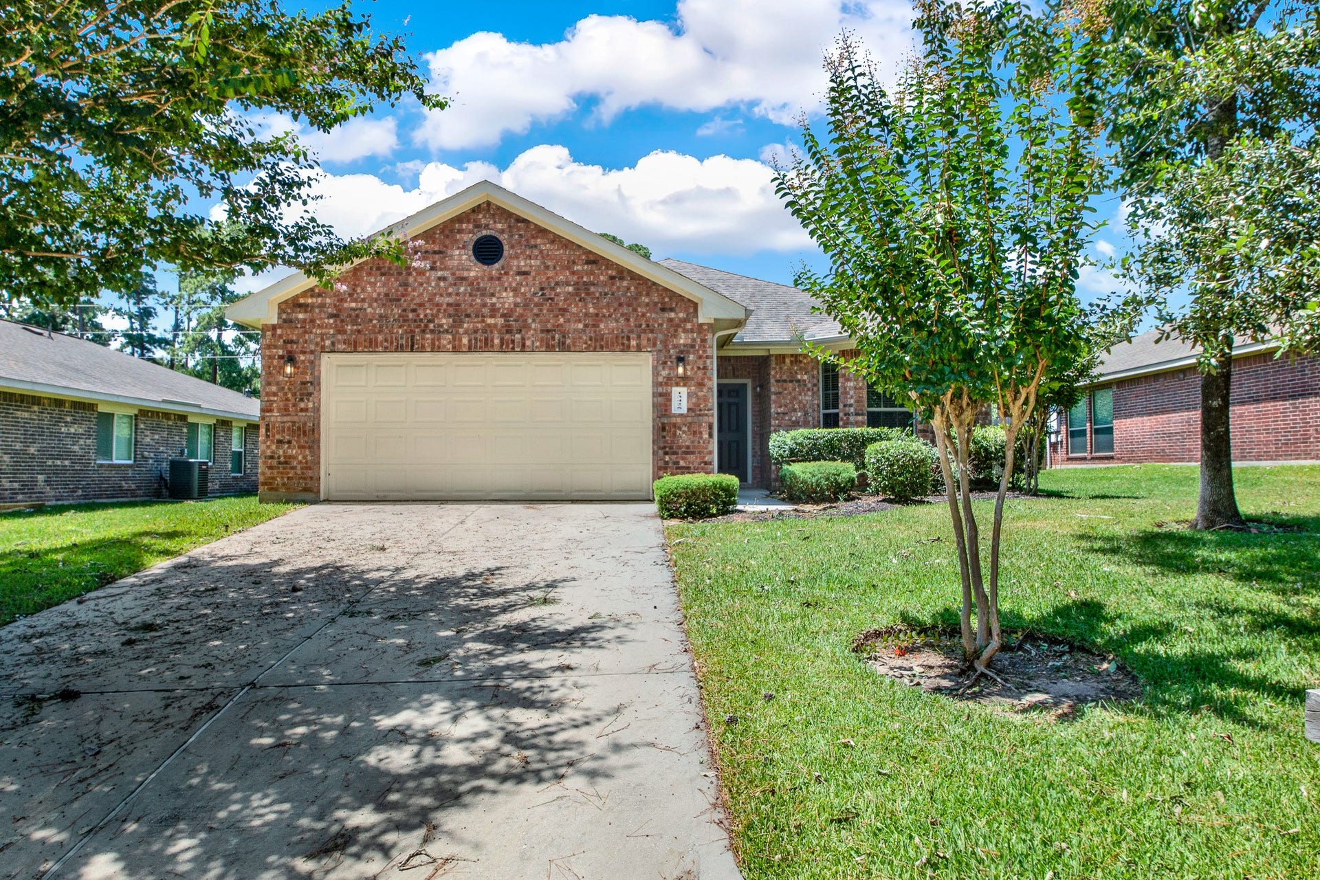 13425 Raintree Drive, Montgomery, TX 77356 Two car garage with additional parking on the double sided driveway.