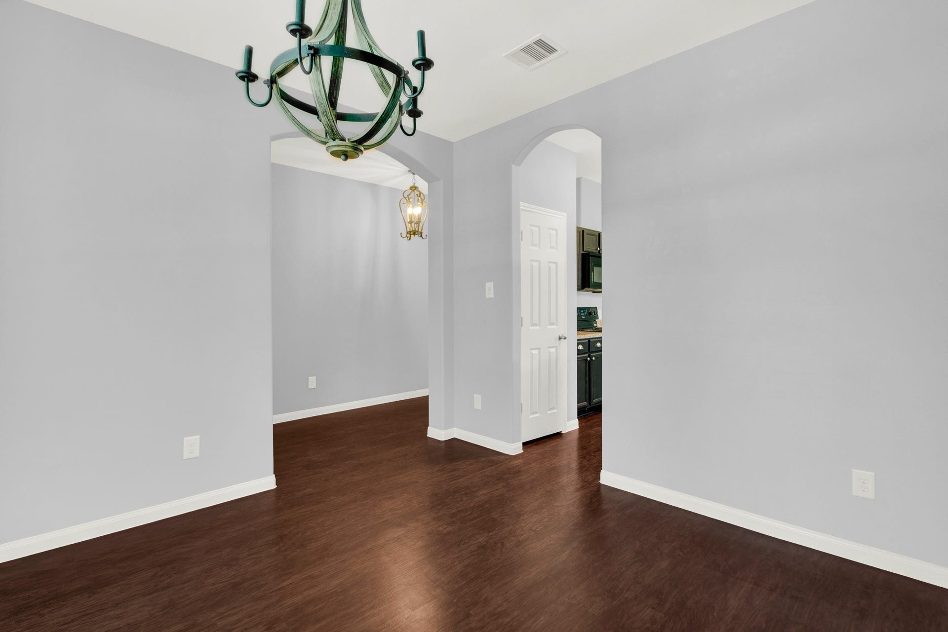 13425 Raintree Drive, Montgomery, TX 77356 View from the dining/study into the entry/hallway on left. Archway leads to the kitchen.