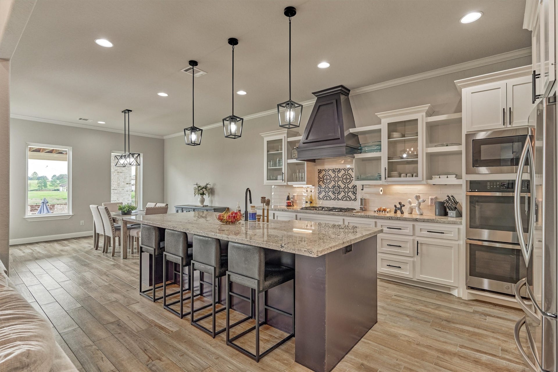 11609 Grand View Drive, Montgomery, TX 77356 The kitchen features island seating and plenty of counter space for entertaining and every day use.