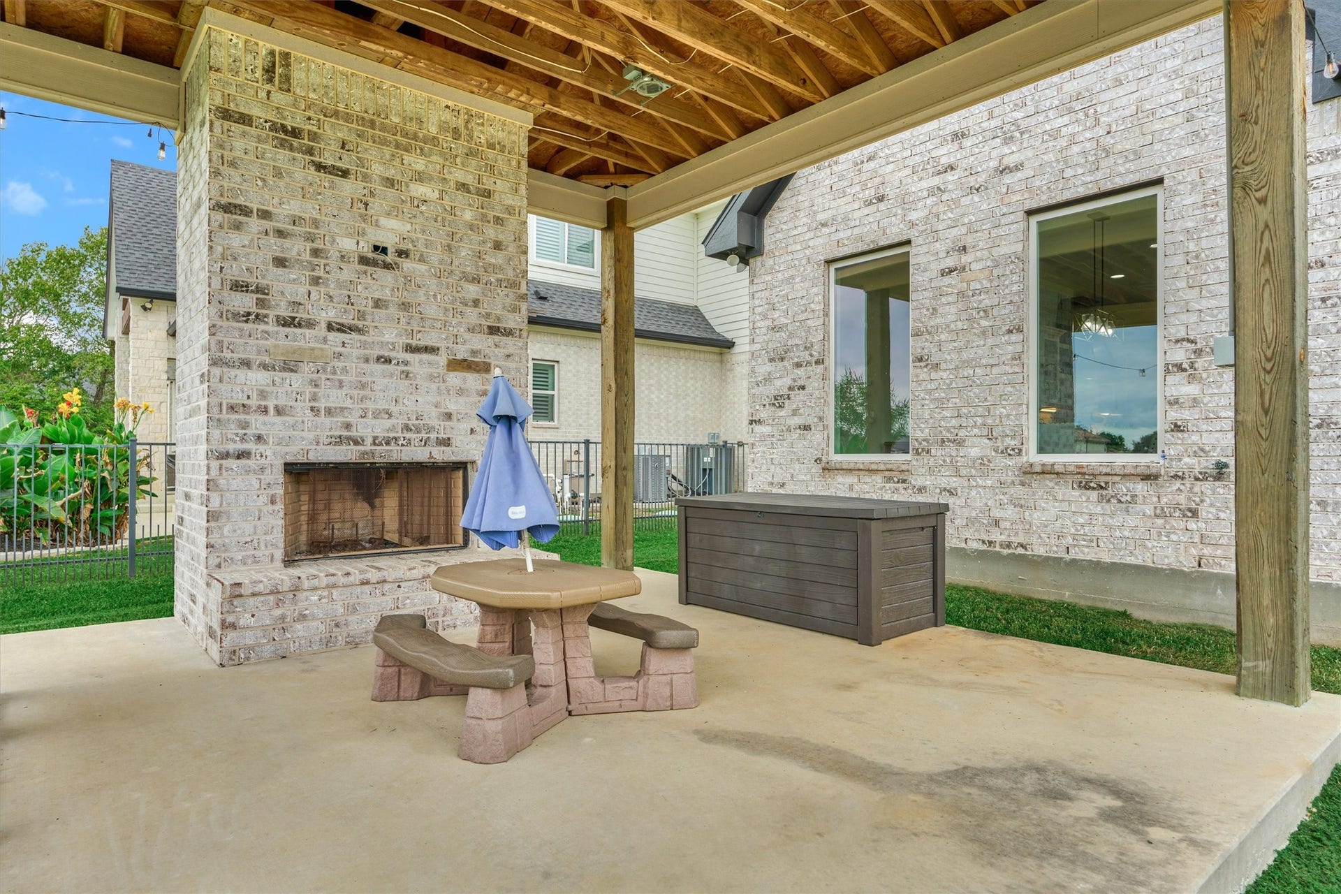 11609 Grand View Drive, Montgomery, TX 77356 The backyard has a covered patio, complete with a fireplace and a place to put your grille!