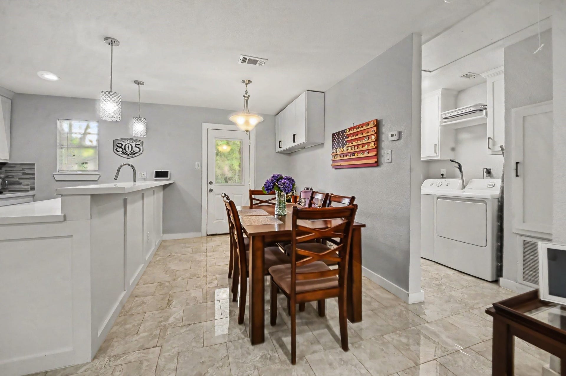 4818 27th Street, Dickinson, TX 77539 The entire length of the peninsula is perfect for a breakfast bar and there is still plenty of space for a dinning table .