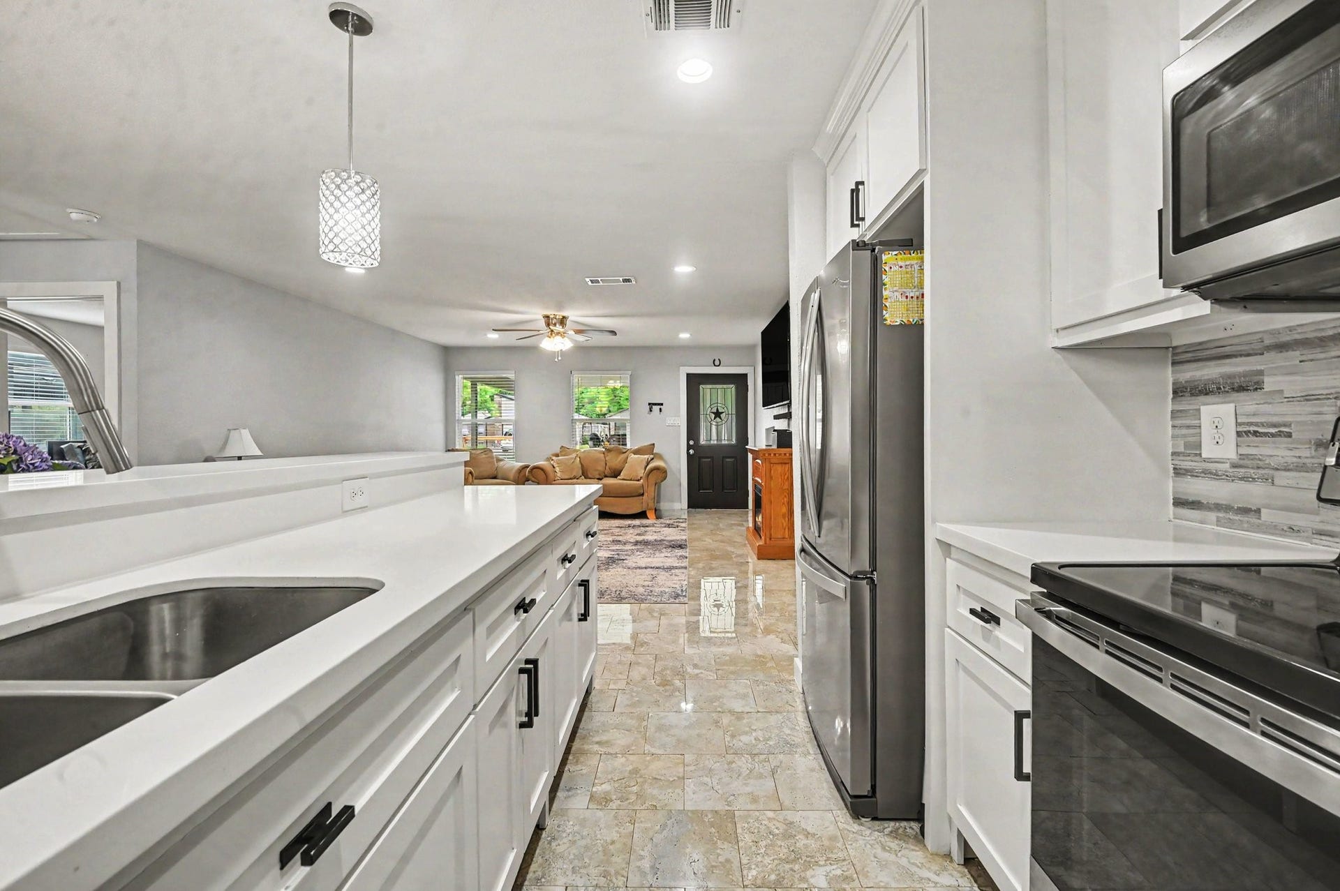 4818 27th Street, Dickinson, TX 77539 With an open concept kitchen, very generous counter top space and bar stool room for the entire length of the kitchen peninsula, the home is perfect for family gatherings and entertainment.