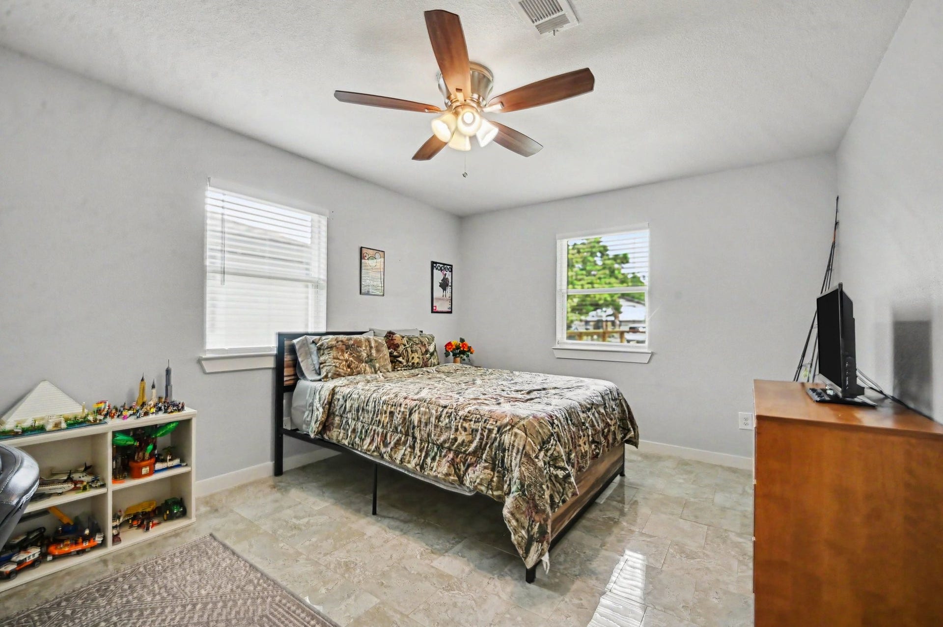 4818 27th Street, Dickinson, TX 77539 The secondary bedroom is situated on the opposite side of the home from the master bedroom and offers a generous space along with a generous closet with plenty of storage.