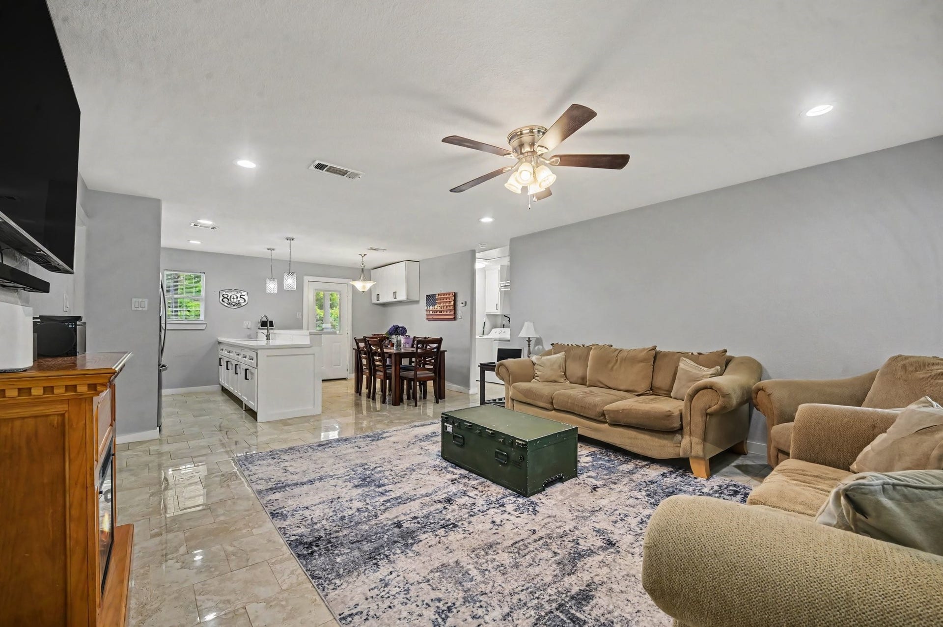 4818 27th Street, Dickinson, TX 77539 The home welcomes you with a open concept, with a generous spaced living area, open kitchen and easy access to the back yard.