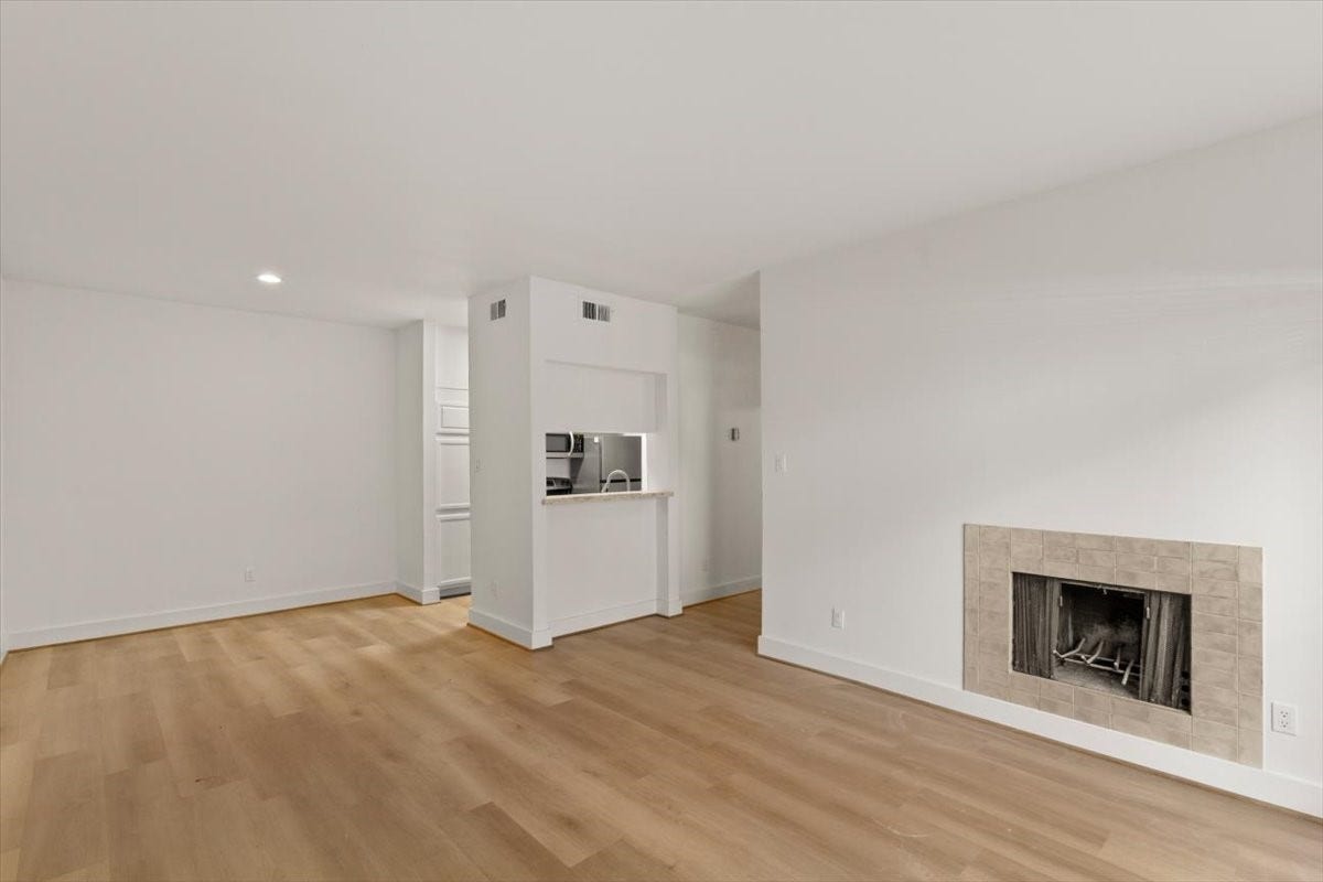 2025 Augusta Drive, #203, Houston, TX 77057 Living Area with Wood Burning Fire Place