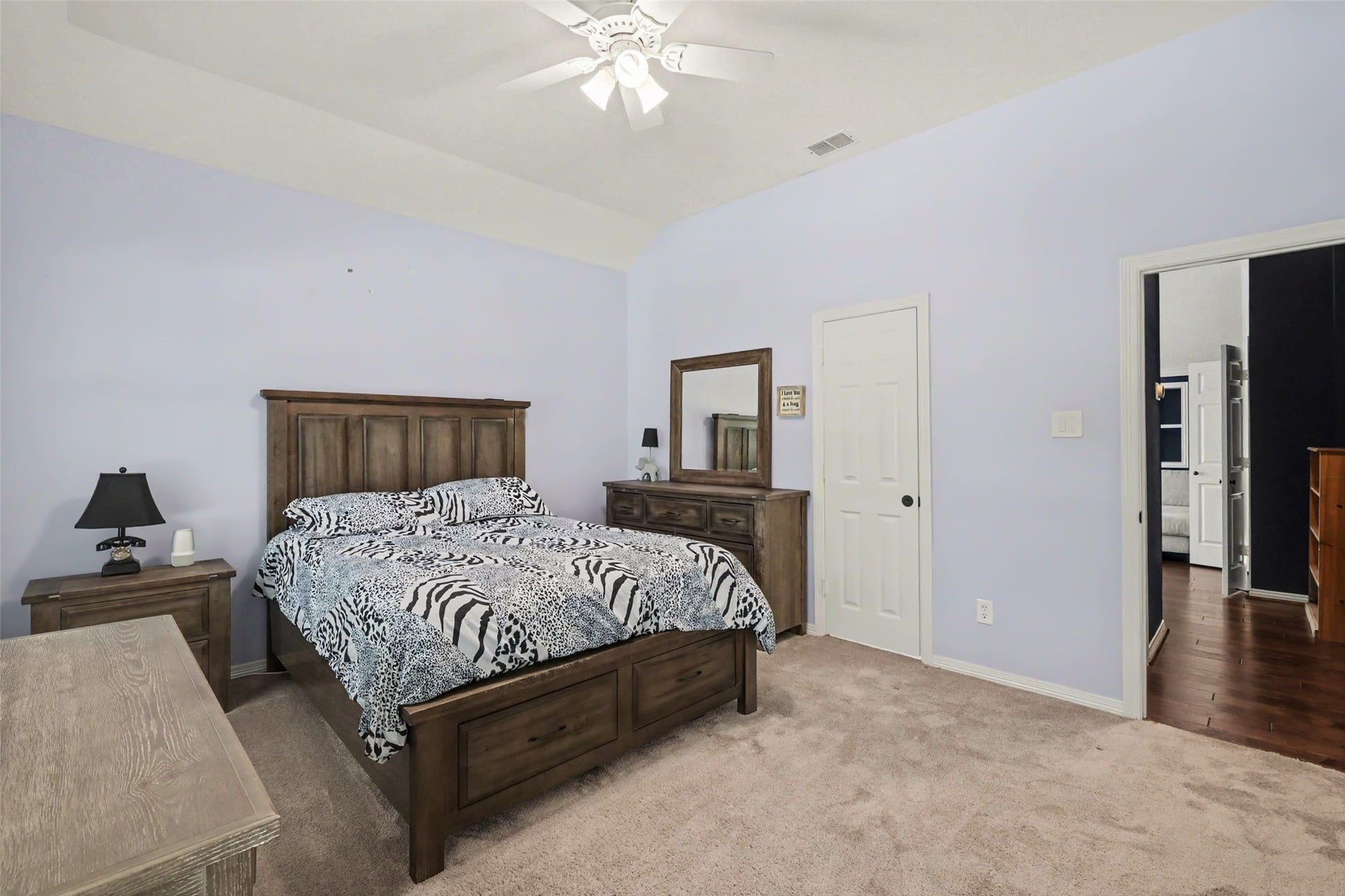 2907 Winding Shore Lane, Katy, TX 77450 Spacious bedroom featuring large windows that fill the space with natural light and double closets offering ample storage. A comfortable and inviting retreat with plenty of room to relax and unwind.