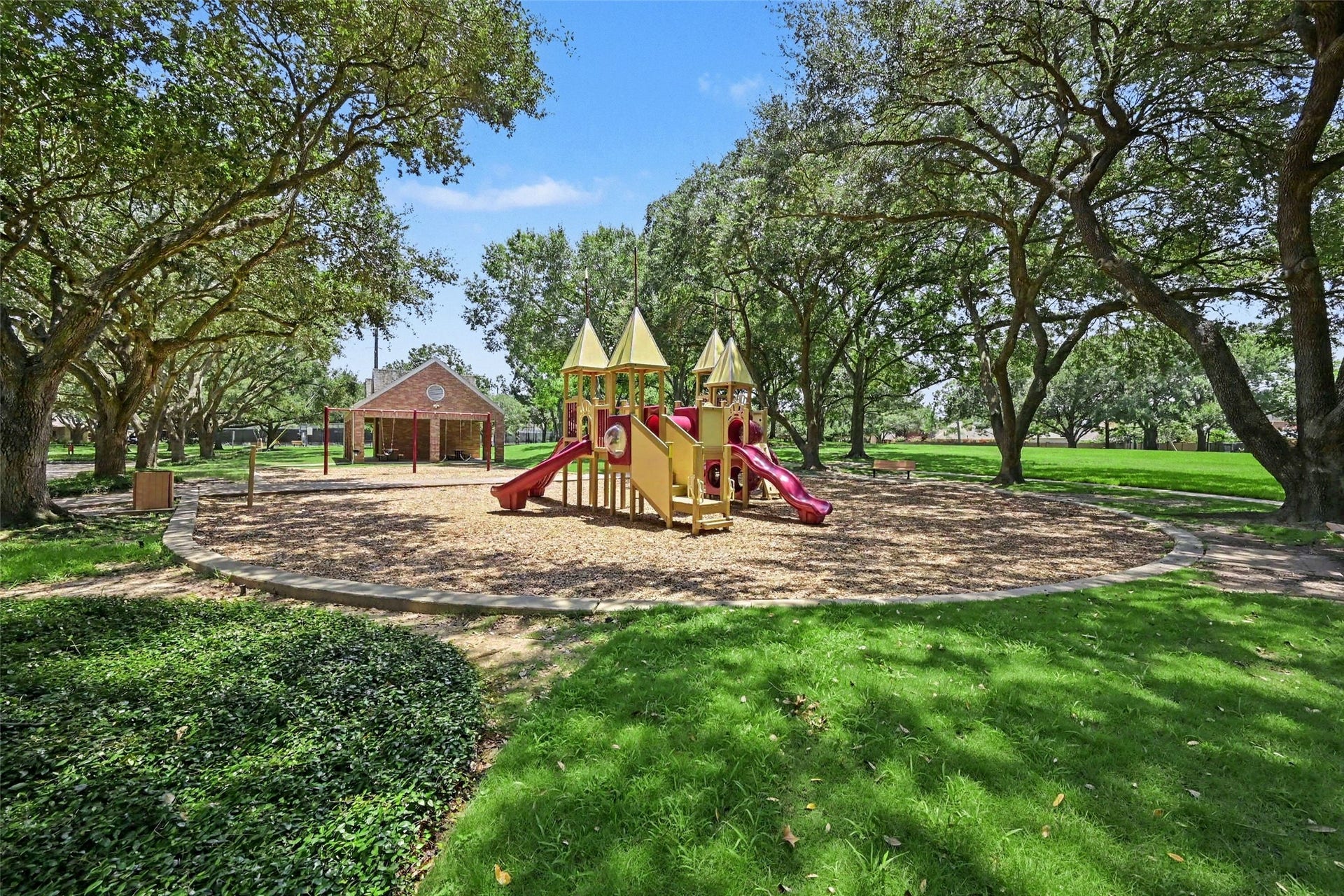 2907 Winding Shore Lane, Katy, TX 77450 Charming community playground within walking distance of the home, surrounded by lush greenery and mature trees. This inviting space offers a wonderful setting for outdoor fun, relaxation, and creating lasting memories.